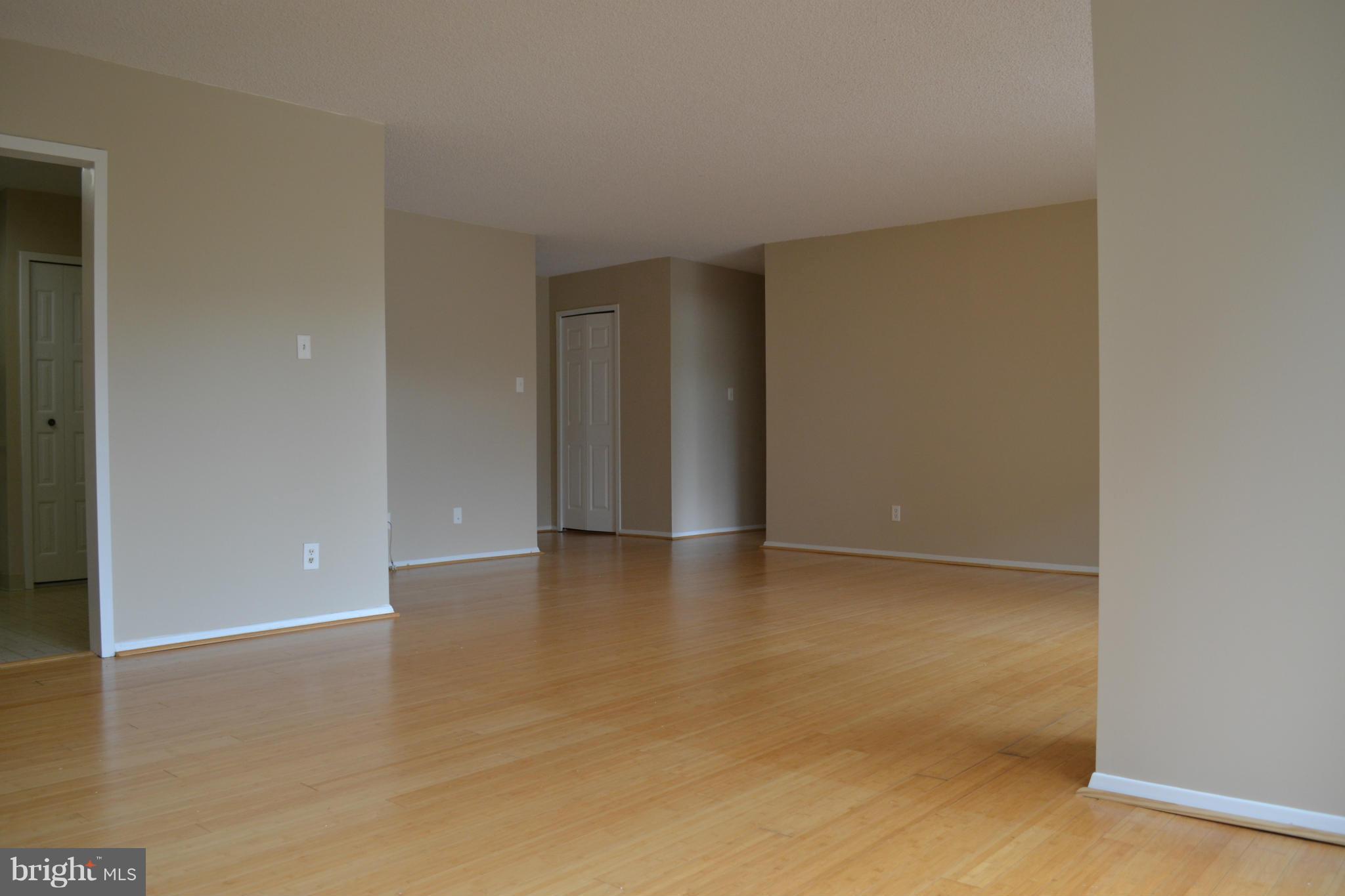 5225 Pooks Hill Road, Unit 204S Bethesda, MD 20814 - Photo 2 of 14 a view of an empty room with wooden floor