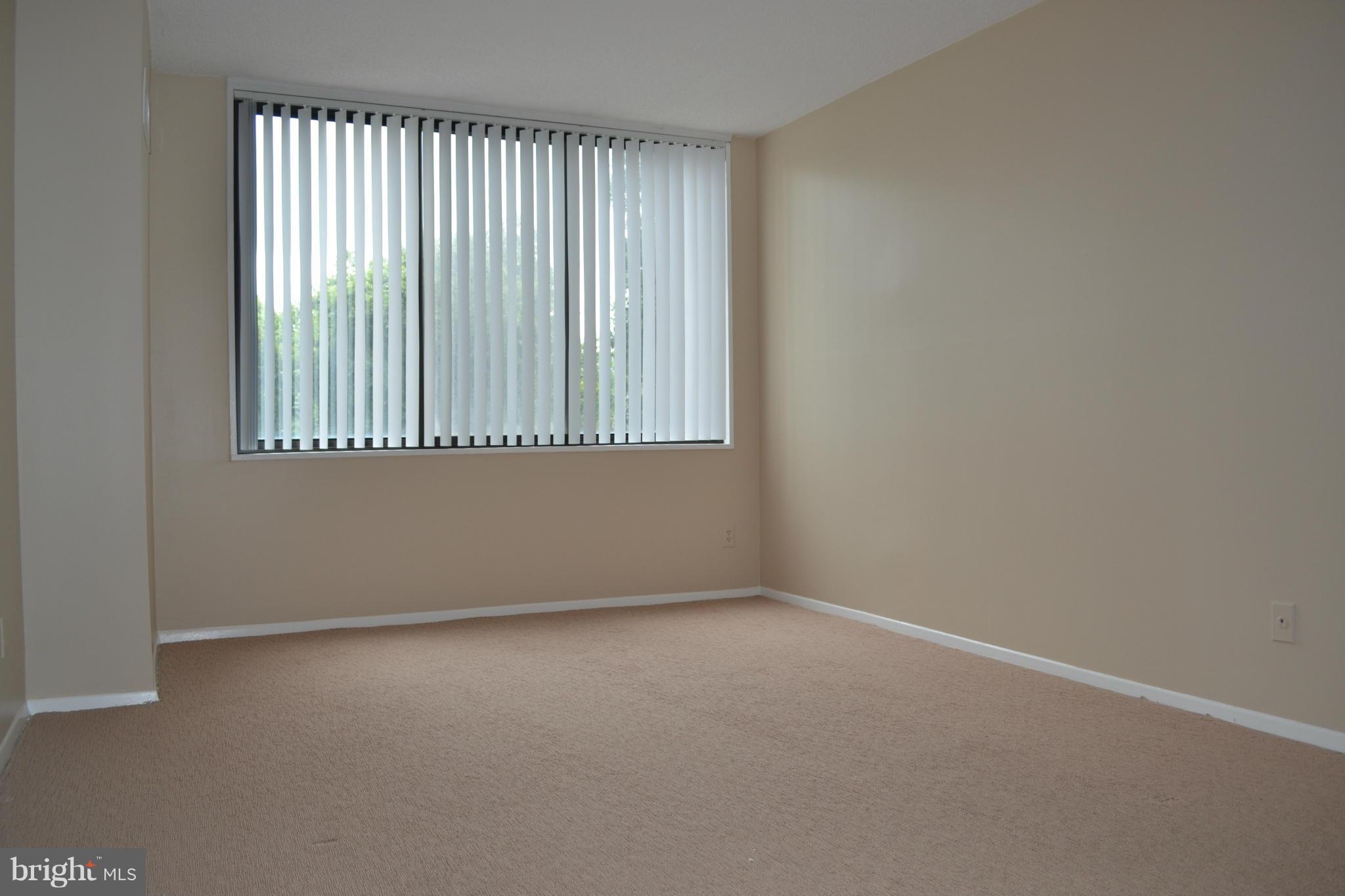5225 Pooks Hill Road, Unit 204S Bethesda, MD 20814 - Photo 8 of 14 an empty room with a window