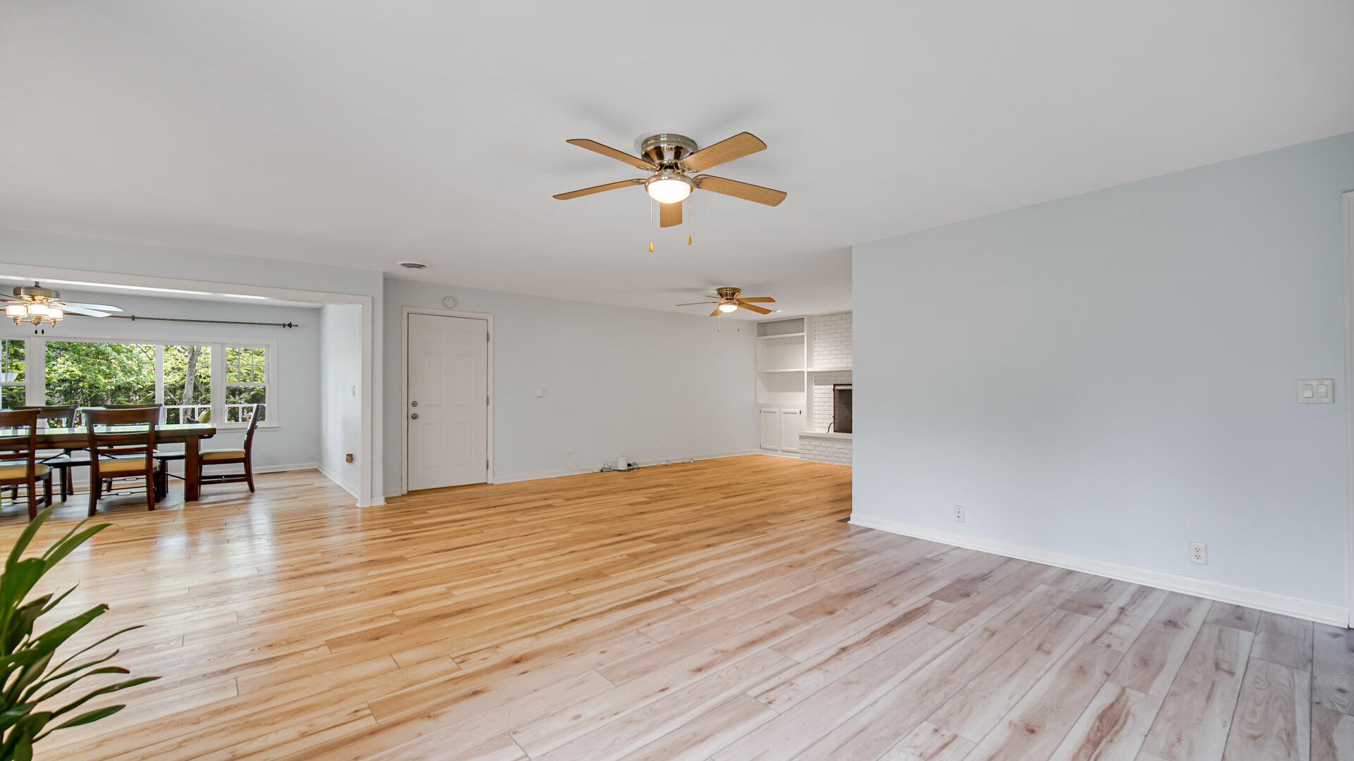 6717 State Rte 49 Rensselaer, IN 47978 - Photo 15 of 31 a view of empty room with wooden floor and fan