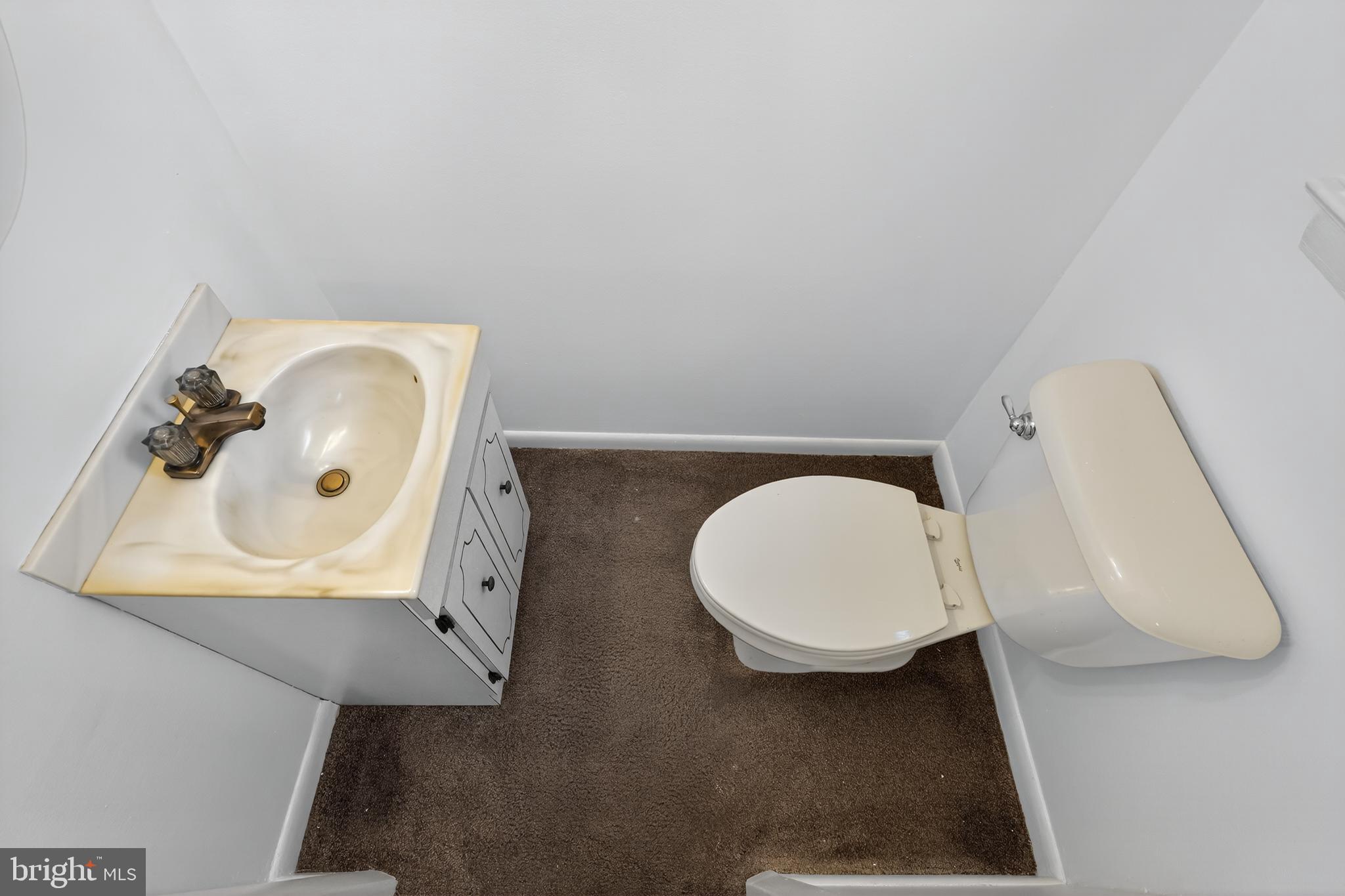 1012 Twist Road Philadelphia, PA 19115 - Photo 13 of 30 a bathroom with a toilet sink and mirror