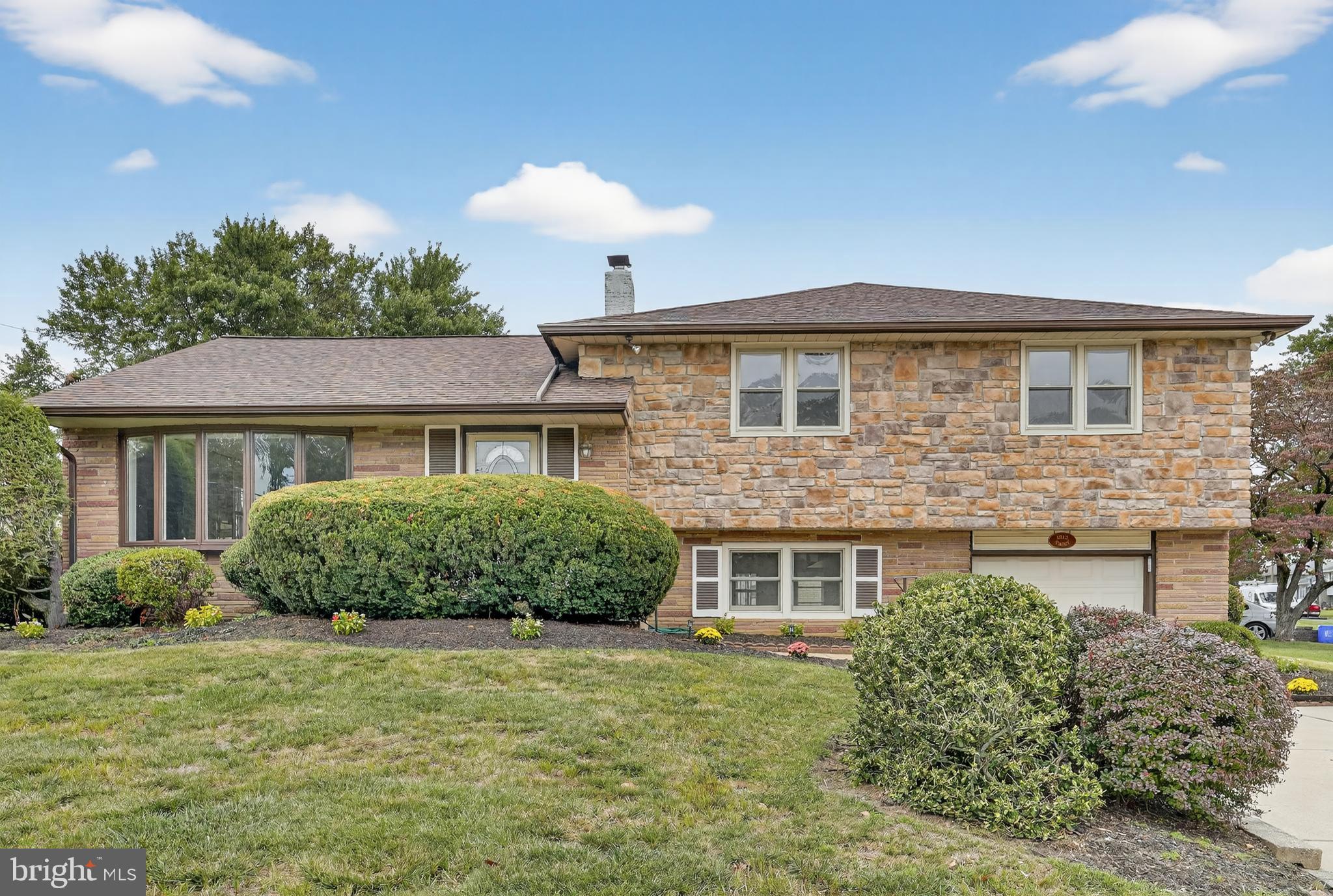 1012 Twist Road Philadelphia, PA 19115 - Photo 3 of 30 a front view of a house with a garden