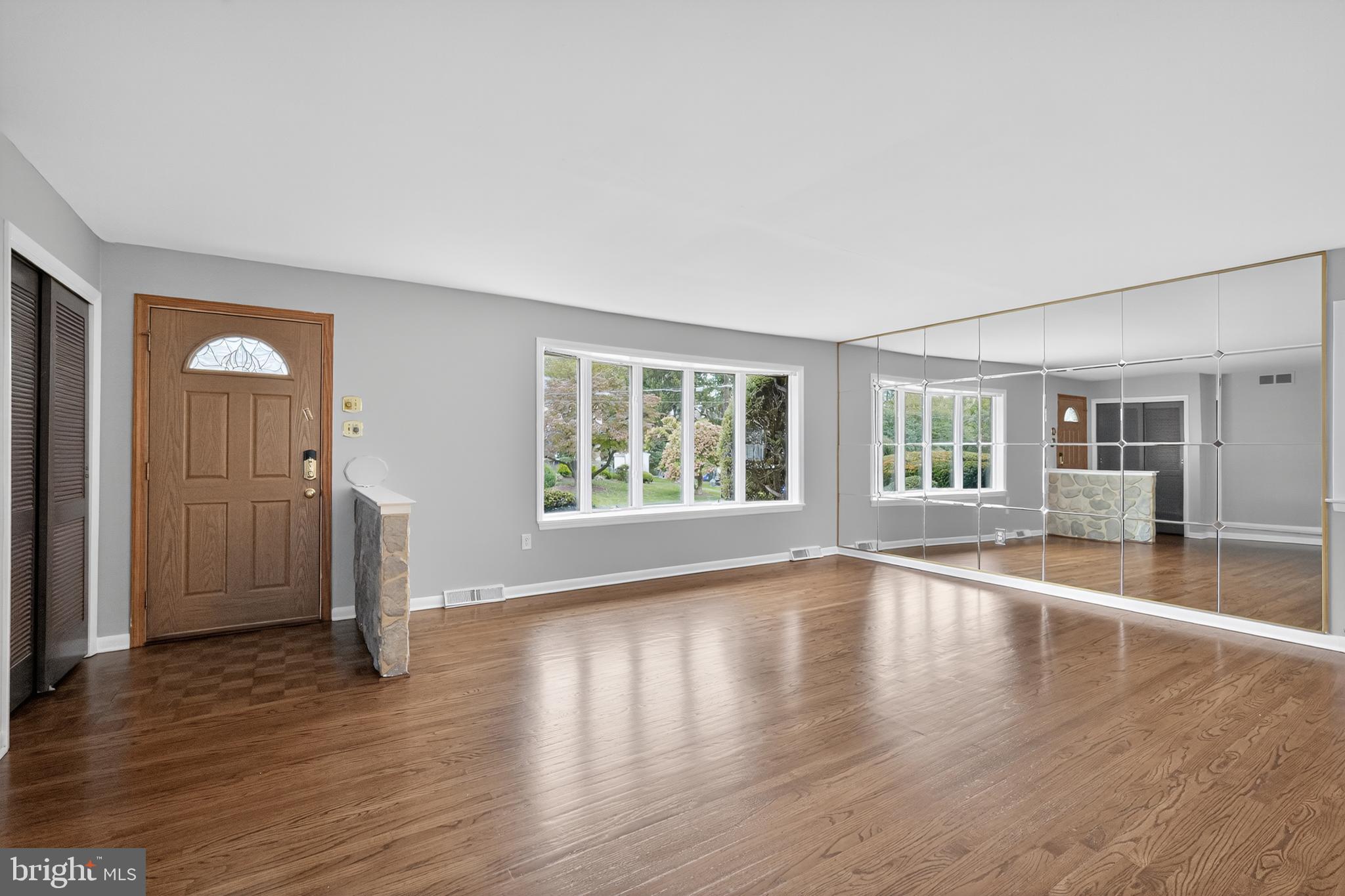 1012 Twist Road Philadelphia, PA 19115 - Photo 4 of 30 an empty room with wooden floor and windows