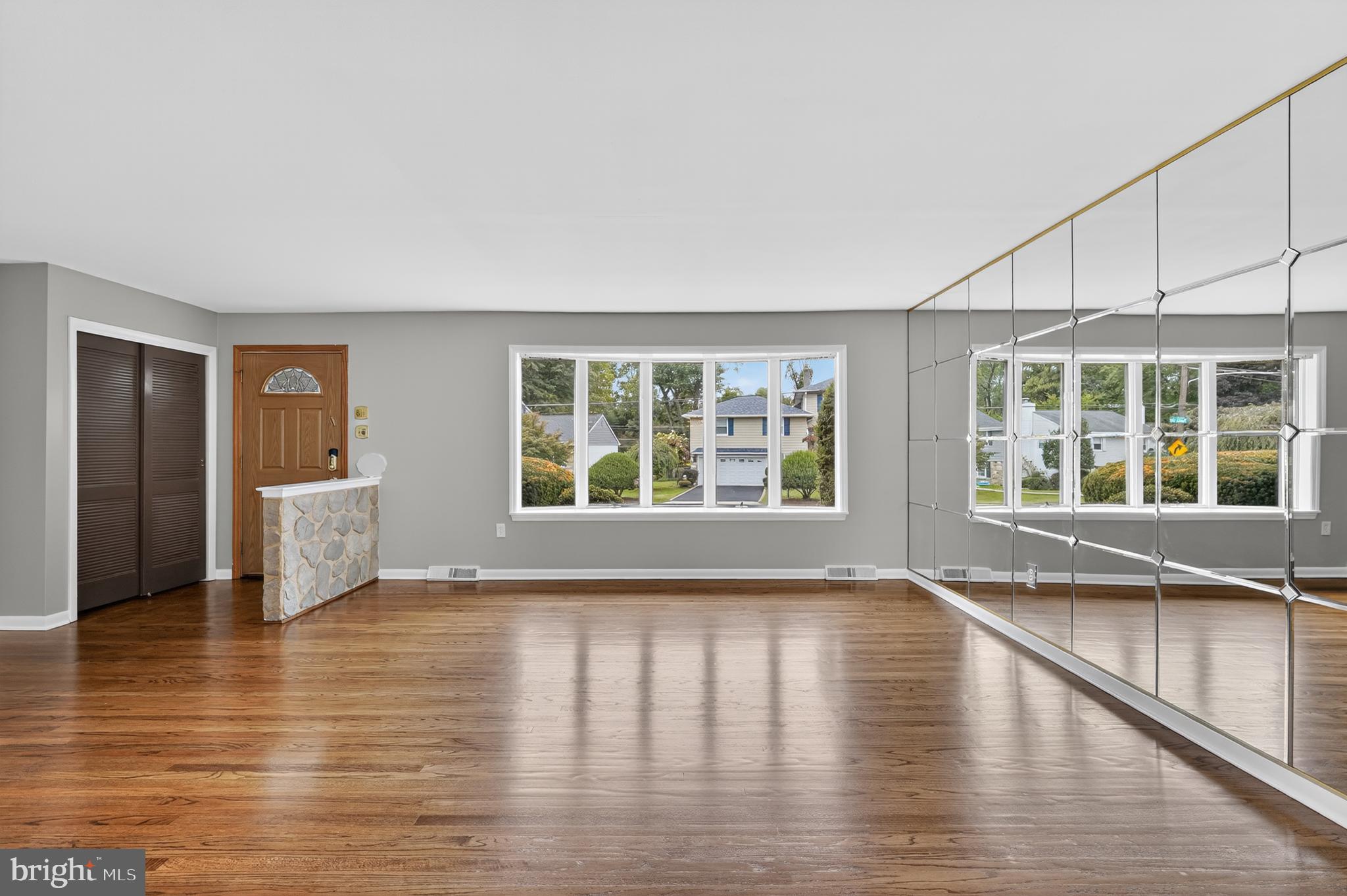 1012 Twist Road Philadelphia, PA 19115 - Photo 5 of 30 a view of an empty room with wooden floor and a window