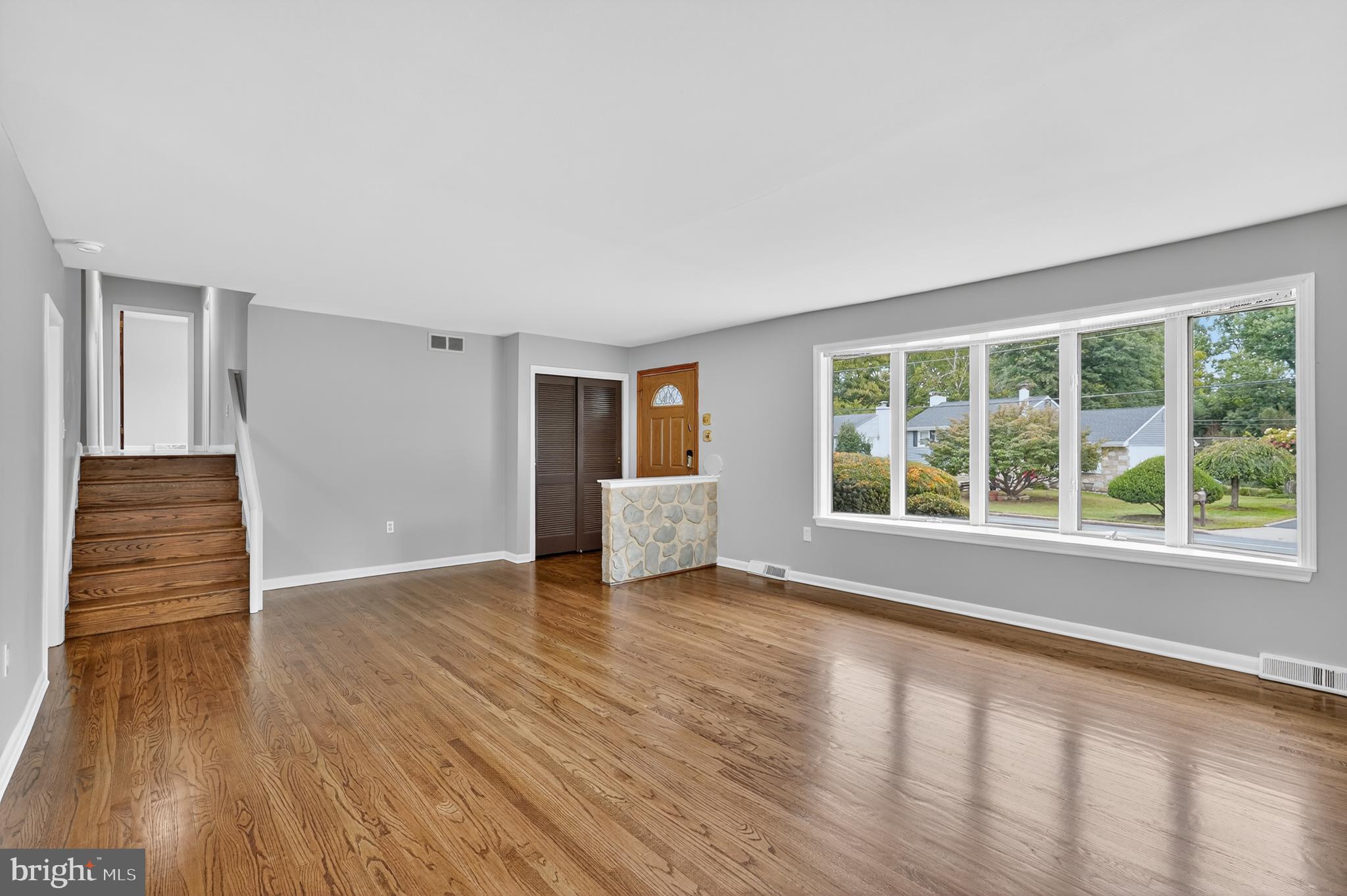 1012 Twist Road Philadelphia, PA 19115 - Photo 6 of 30 a view of an empty room with wooden floor and a window
