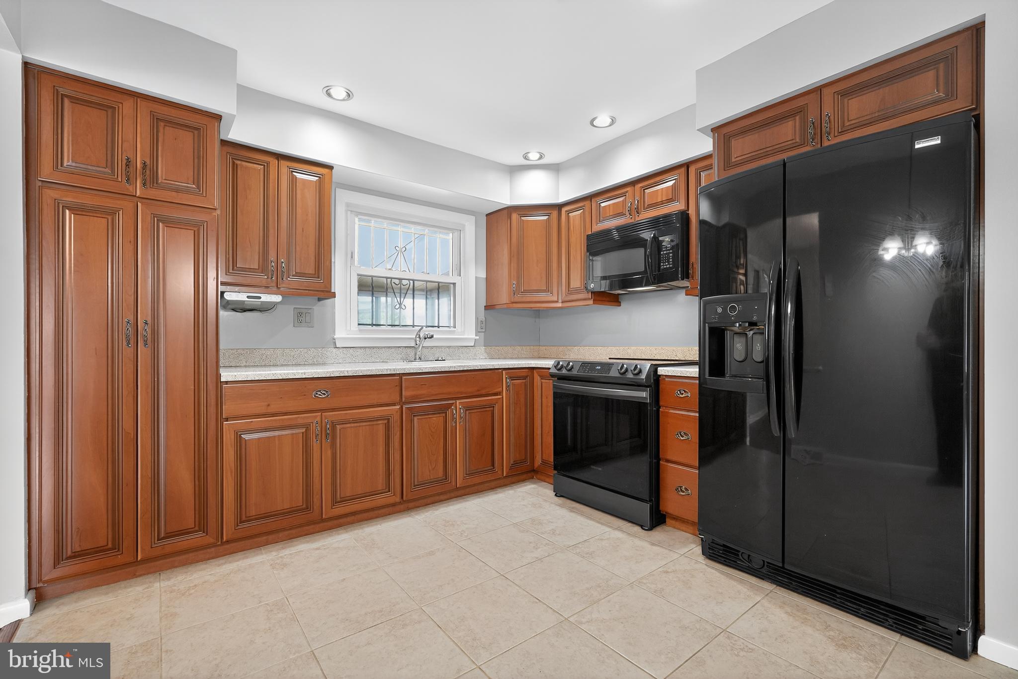 1012 Twist Road Philadelphia, PA 19115 - Photo 10 of 30 a kitchen with stainless steel appliances granite countertop a refrigerator and a sink