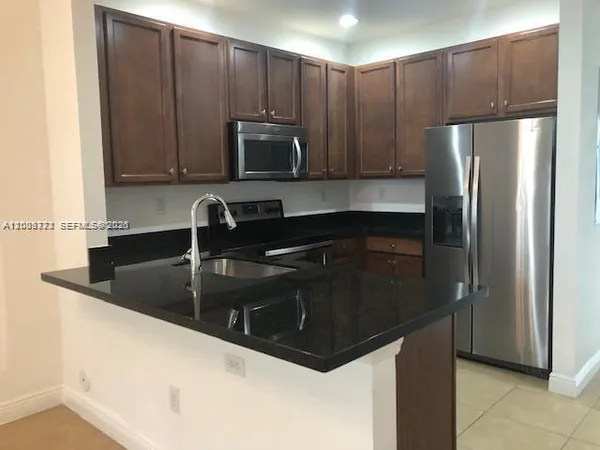 a kitchen with a sink and a cabinets