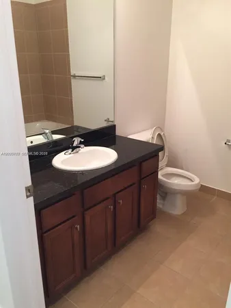 a bathroom with a sink and a toilet