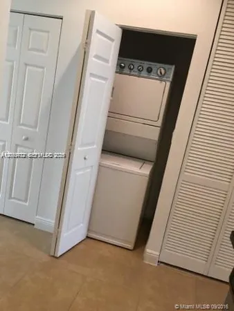 a view of a hardwood & utility room