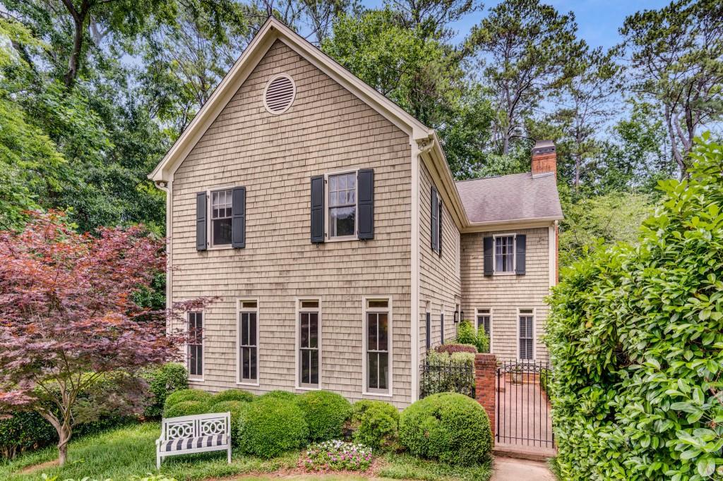a aerial view of a house next to a yard