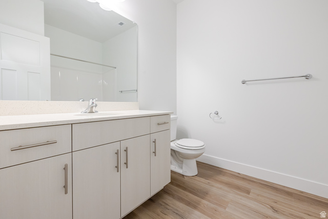 675 West 4500th South, Unit P204 Mapleton, UT 84664 - Photo 7 of 16 Bathroom featuring a single vanity with light-toned cabinetry, a spacious countertop, and a large mirror