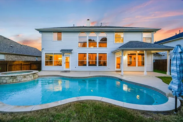 a view of a house with a swimming pool