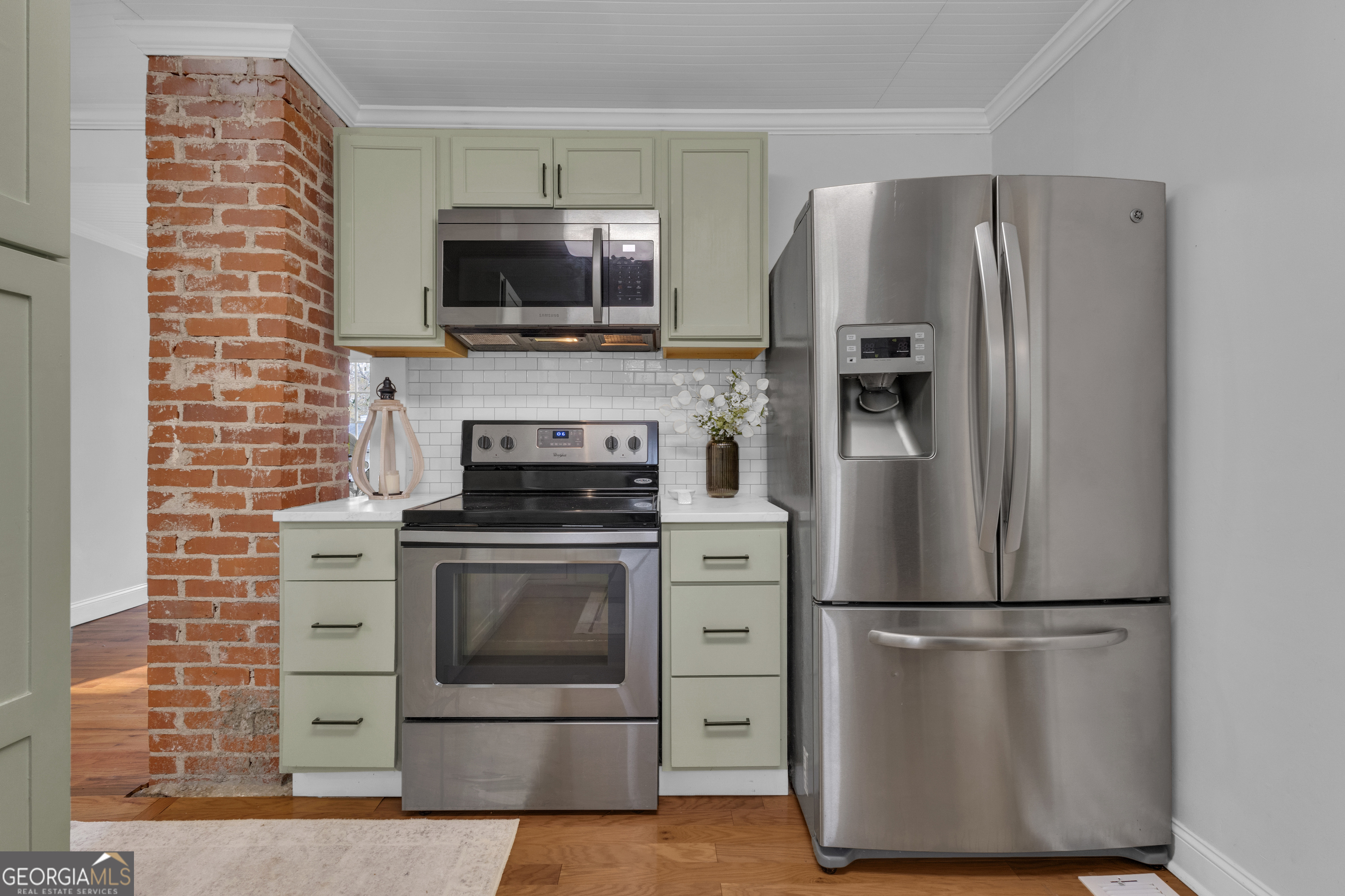 9 Meridian Drive Newnan, GA 30263 - Photo 18 of 42 a kitchen with a stainless steel appliances wooden cabinets and a counter top space