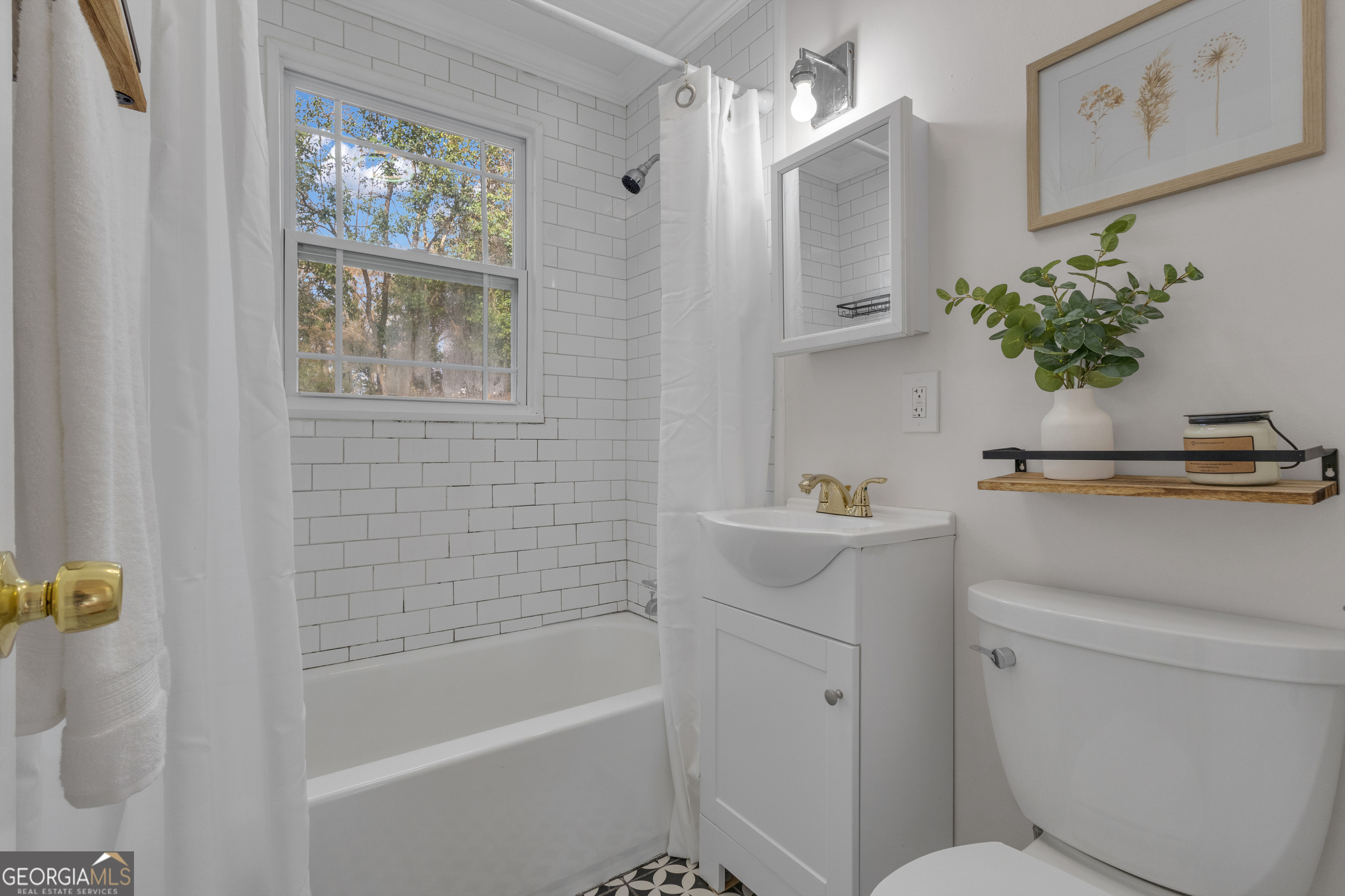 9 Meridian Drive Newnan, GA 30263 - Photo 19 of 42 a bathroom with a sink a toilet and shower