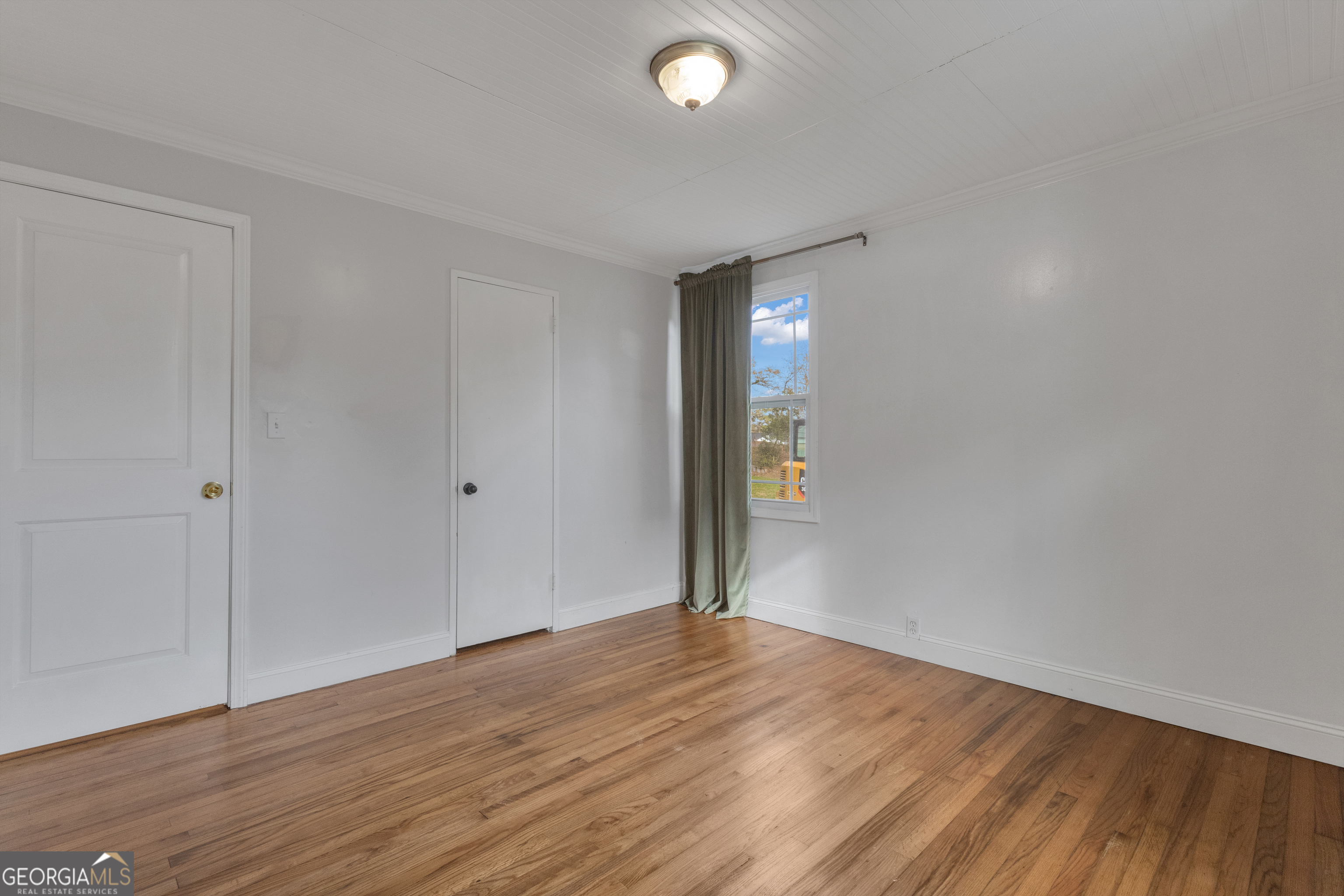 9 Meridian Drive Newnan, GA 30263 - Photo 21 of 42 a view of empty room with wooden floor