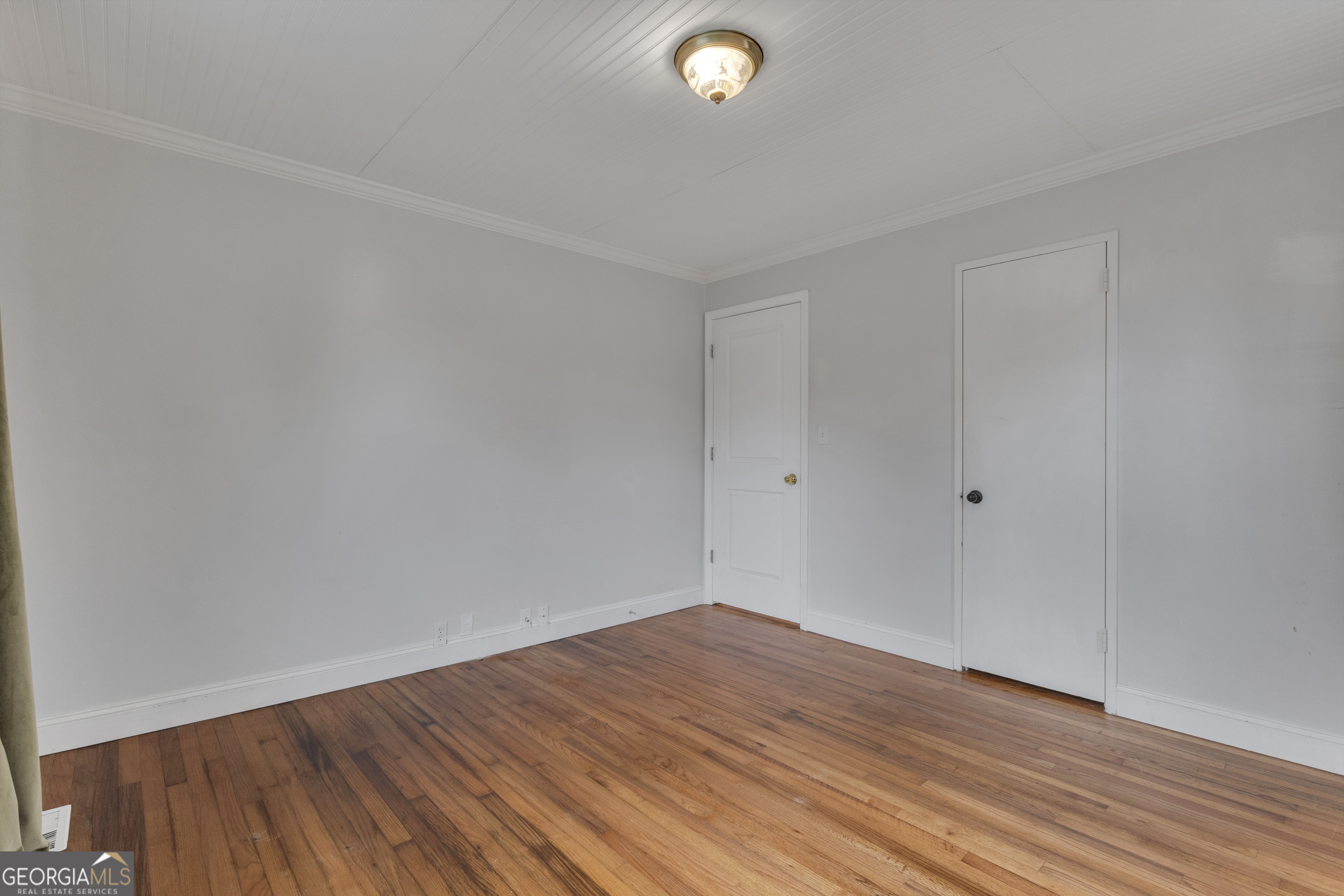 9 Meridian Drive Newnan, GA 30263 - Photo 22 of 42 a view of empty room with wooden floor