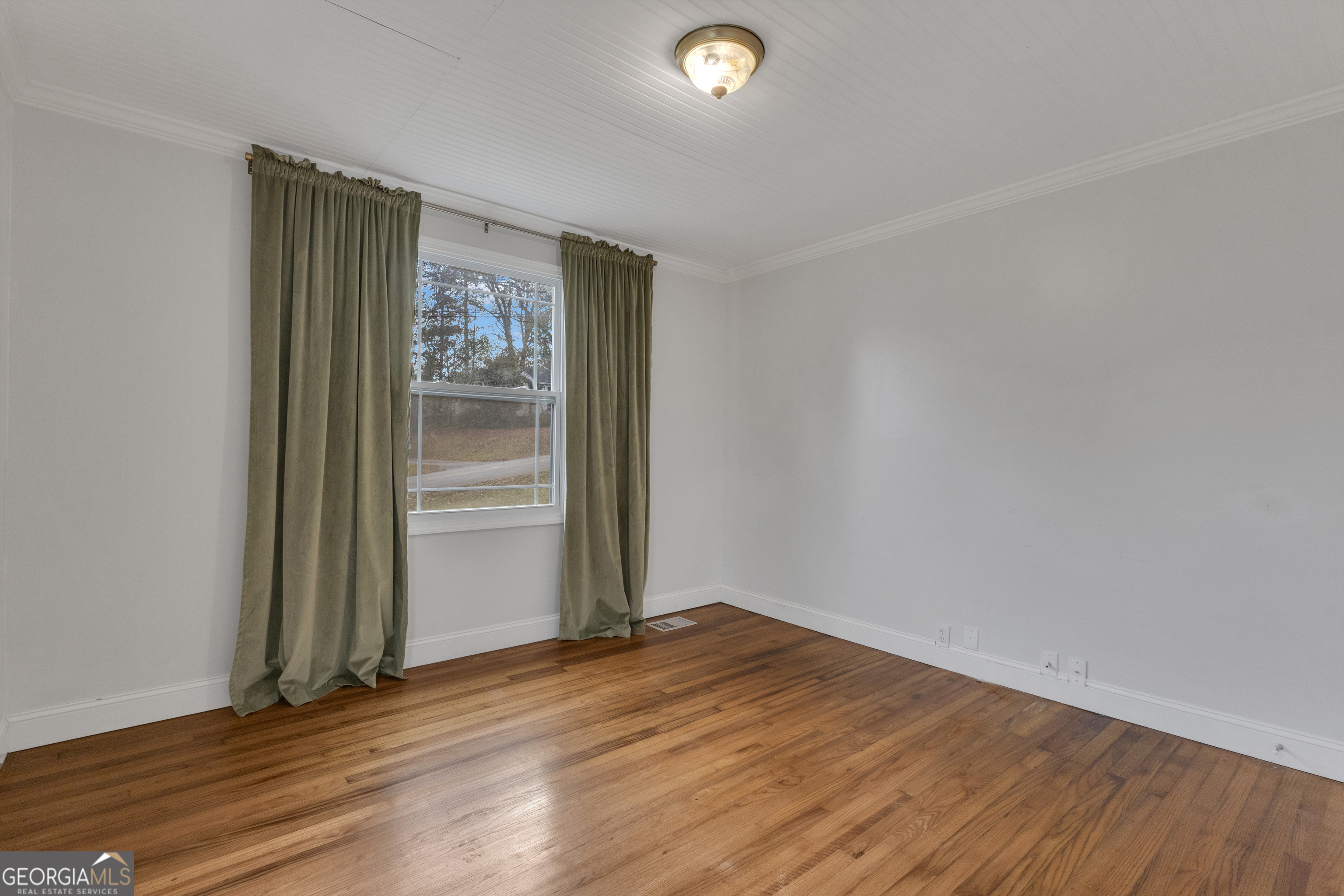 9 Meridian Drive Newnan, GA 30263 - Photo 23 of 42 an empty room with wooden floor and closet