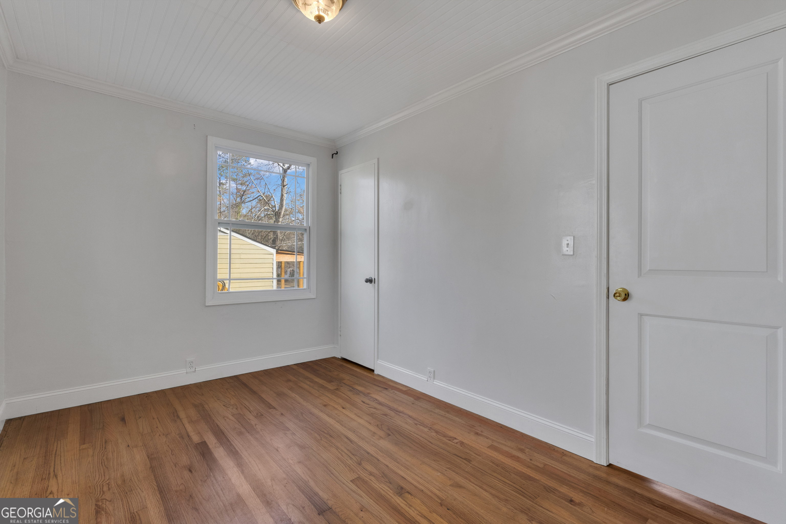 9 Meridian Drive Newnan, GA 30263 - Photo 25 of 42 an empty room with wooden floor and windows
