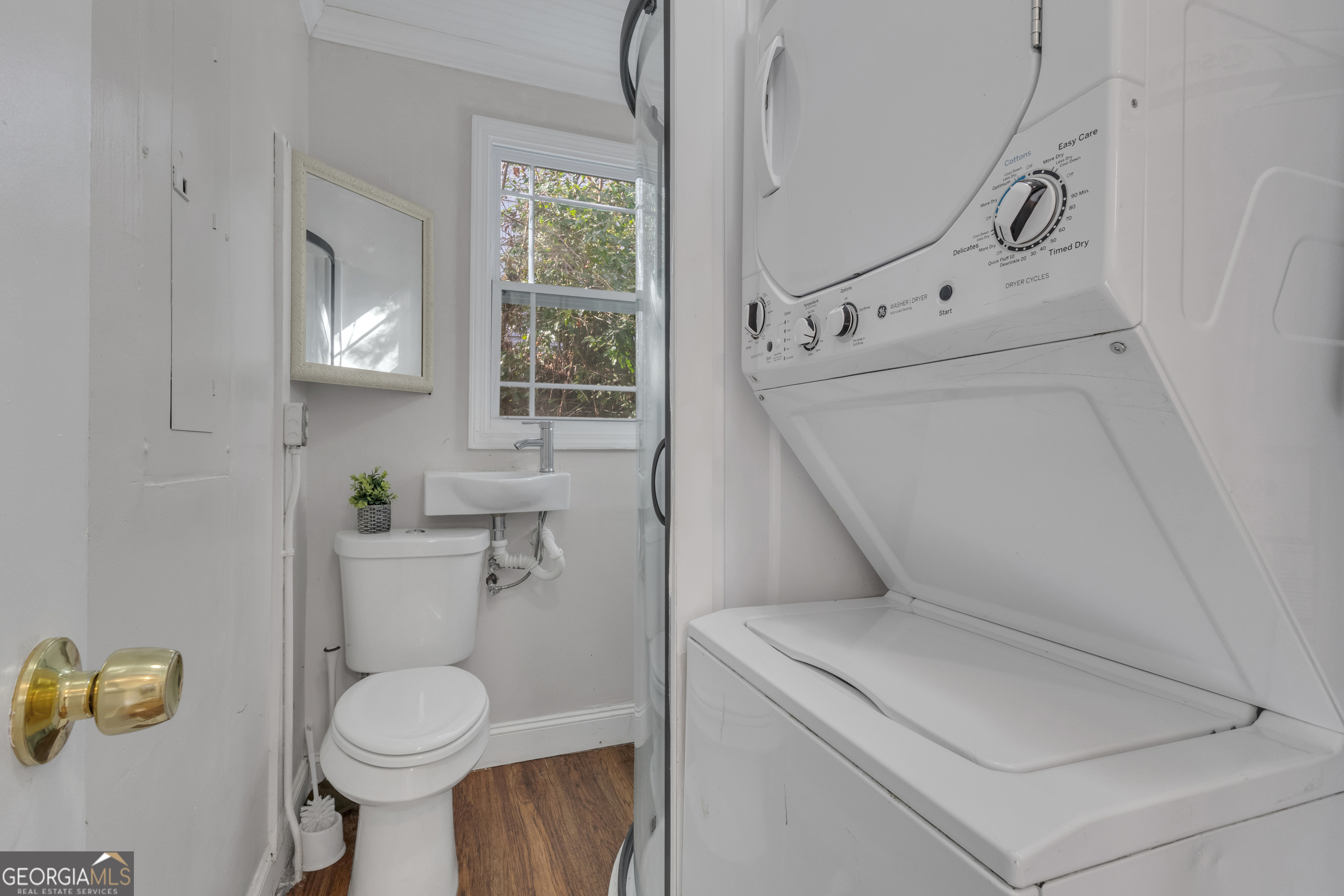 9 Meridian Drive Newnan, GA 30263 - Photo 31 of 42 a bathroom with a toilet sink vanity tub and mirror