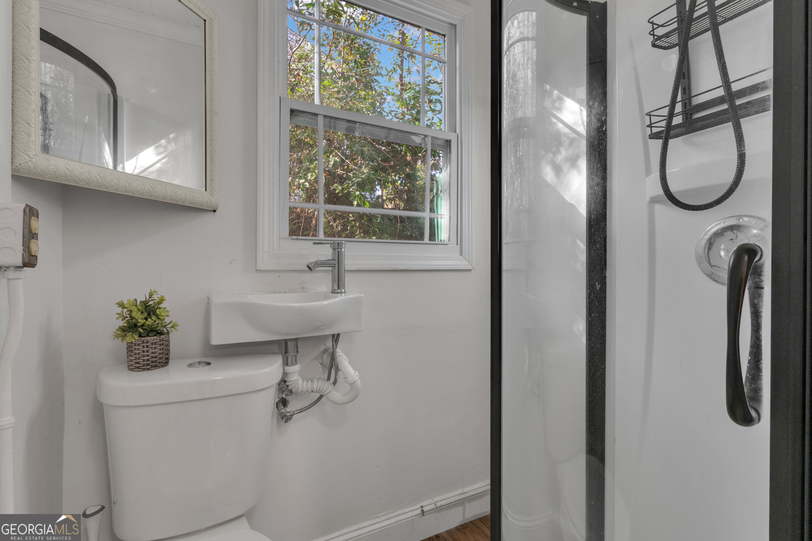 9 Meridian Drive Newnan, GA 30263 - Photo 32 of 42 a bathroom with a sink toilet and a mirror