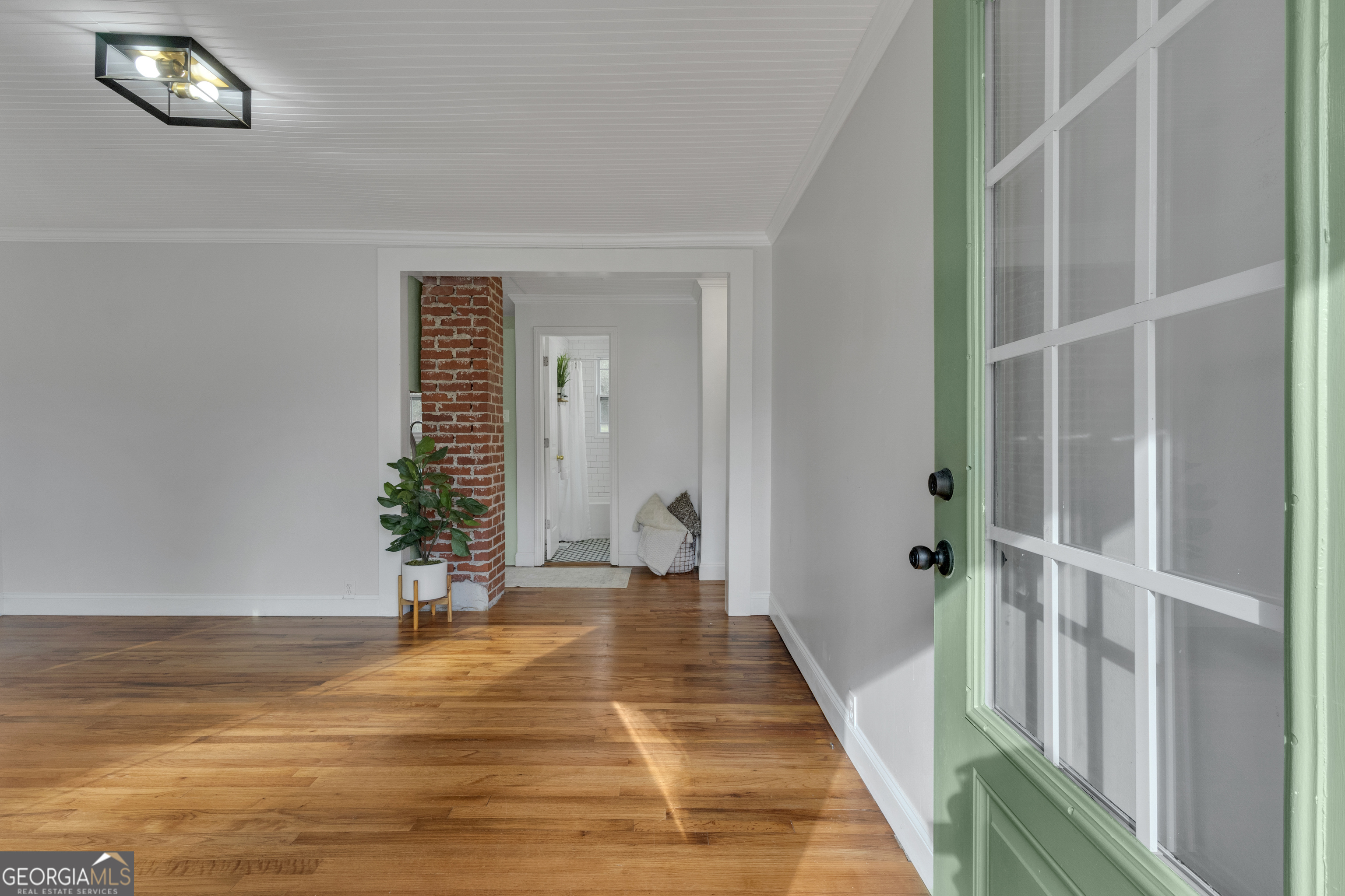 9 Meridian Drive Newnan, GA 30263 - Photo 7 of 42 a view of a bedroom with wooden floor and a window
