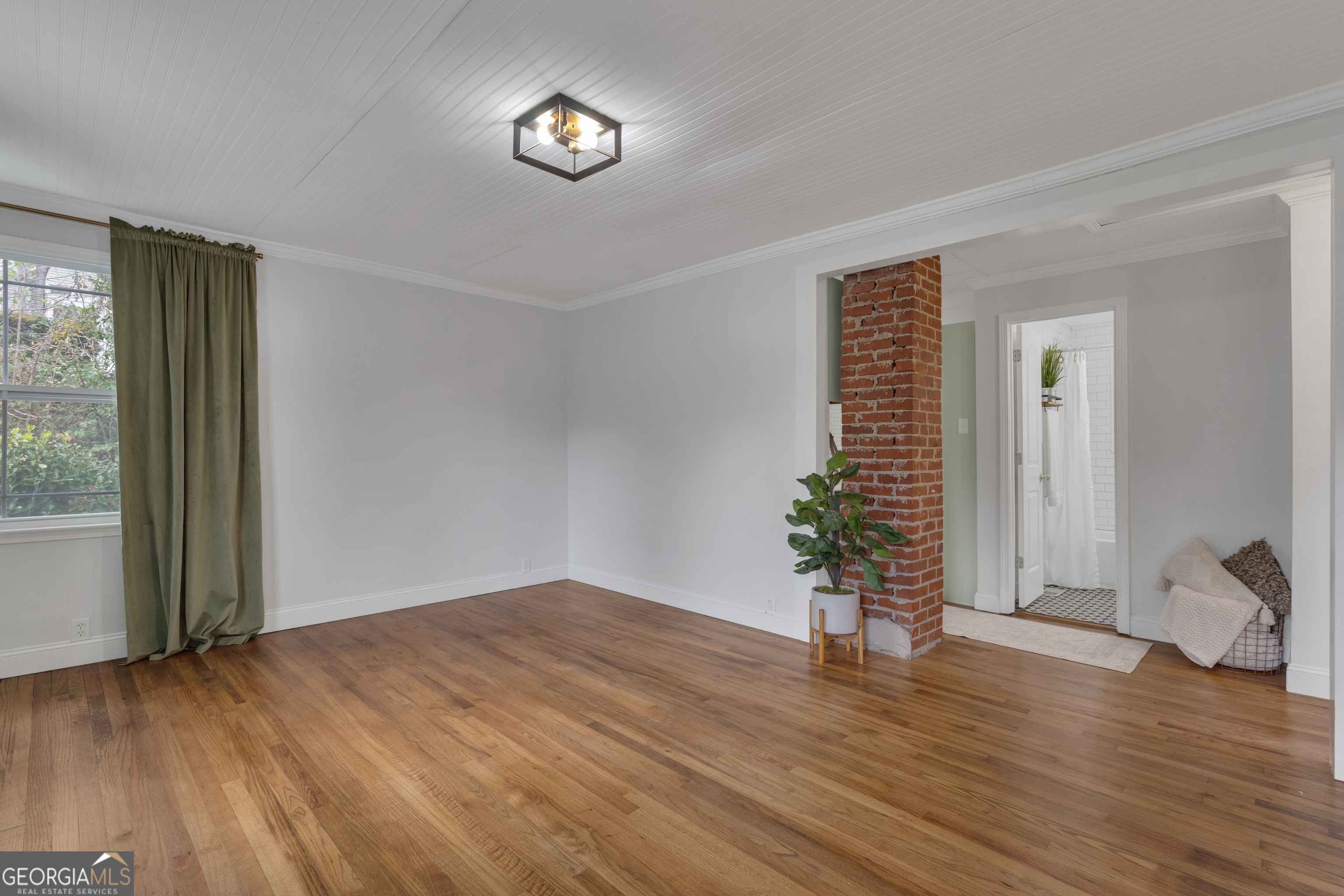 9 Meridian Drive Newnan, GA 30263 - Photo 8 of 42 an empty room with wooden floor and windows