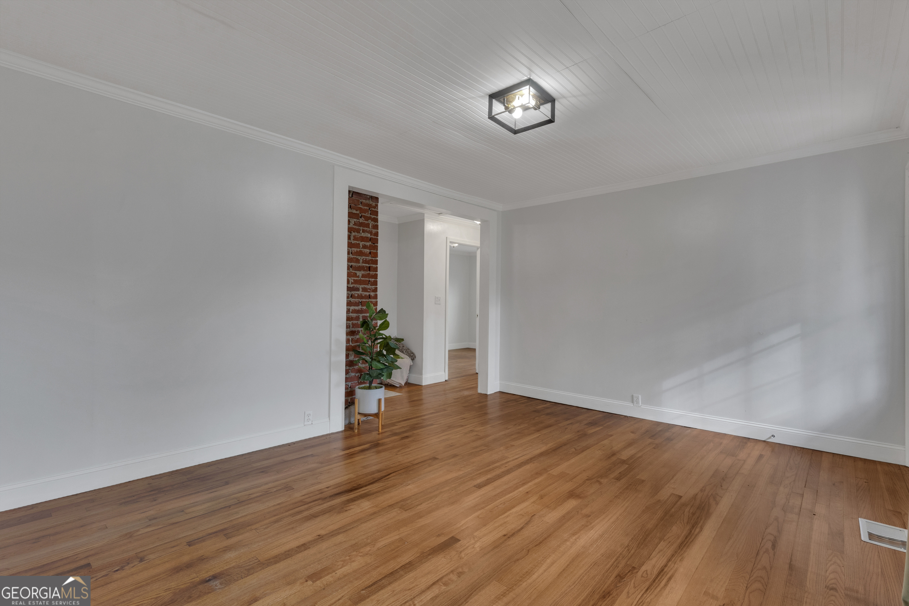 9 Meridian Drive Newnan, GA 30263 - Photo 10 of 42 a view of an empty room with wooden floor and a window