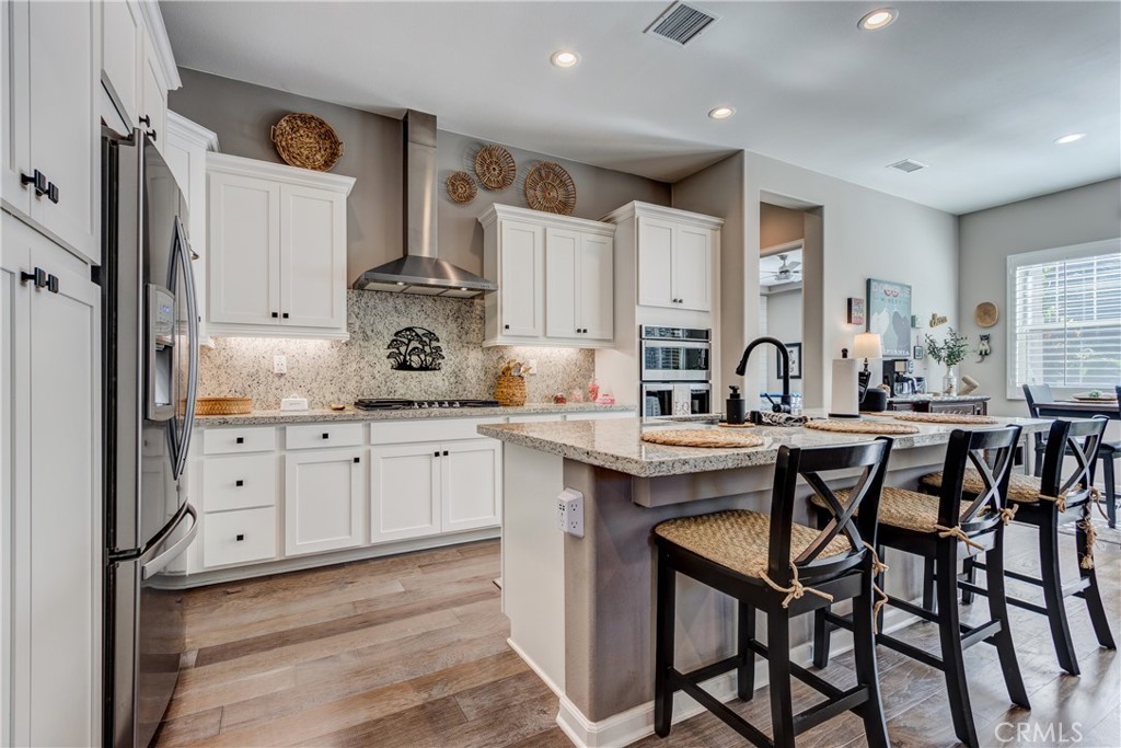 11137 Briar Rose Court Corona, CA 92883 - Photo 16 of 75 a kitchen with cabinets appliances and a counter top space