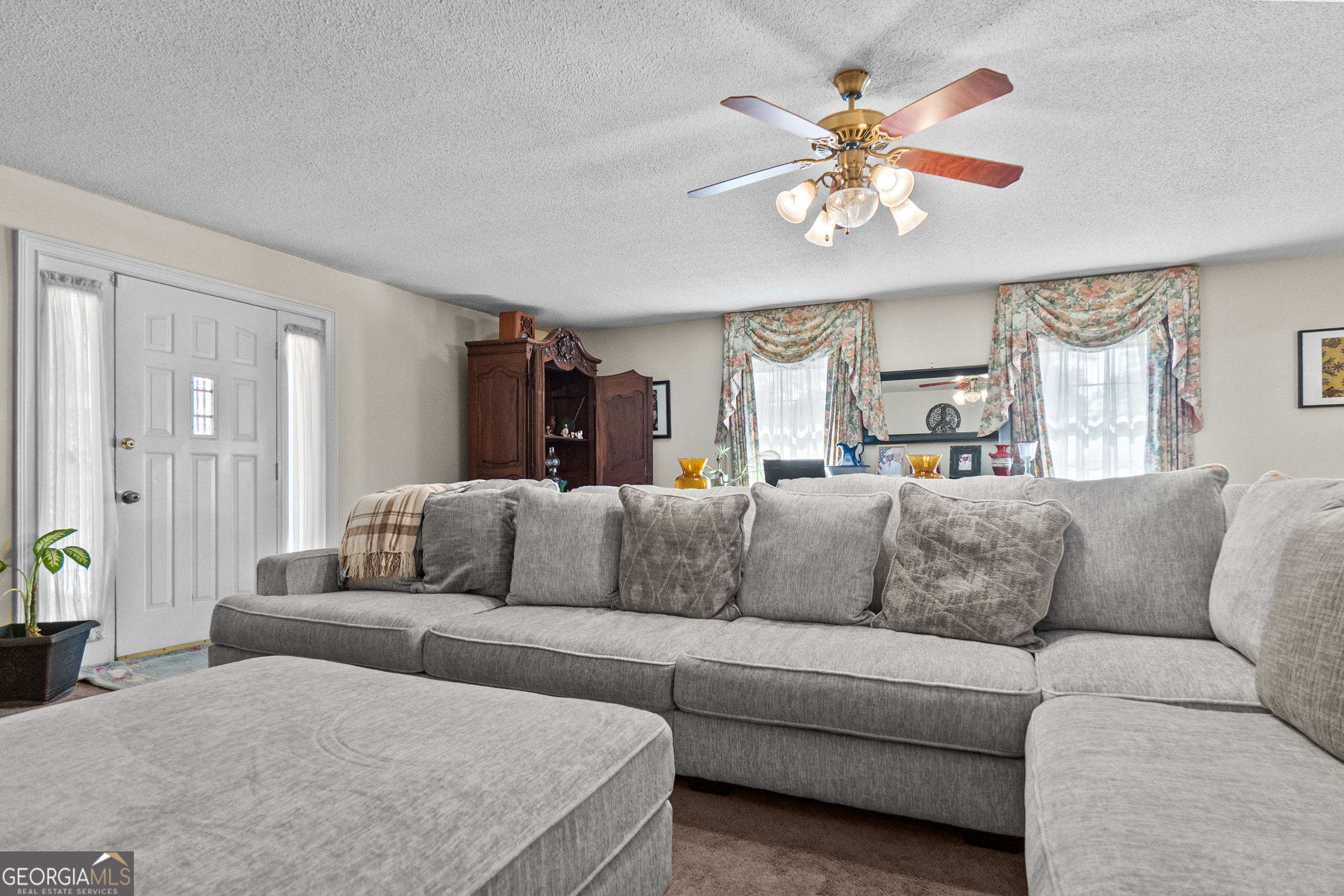 2101 Goldendale Lane Albany, GA 31721 - Photo 18 of 59 a living room with furniture chandelier and a chandelier