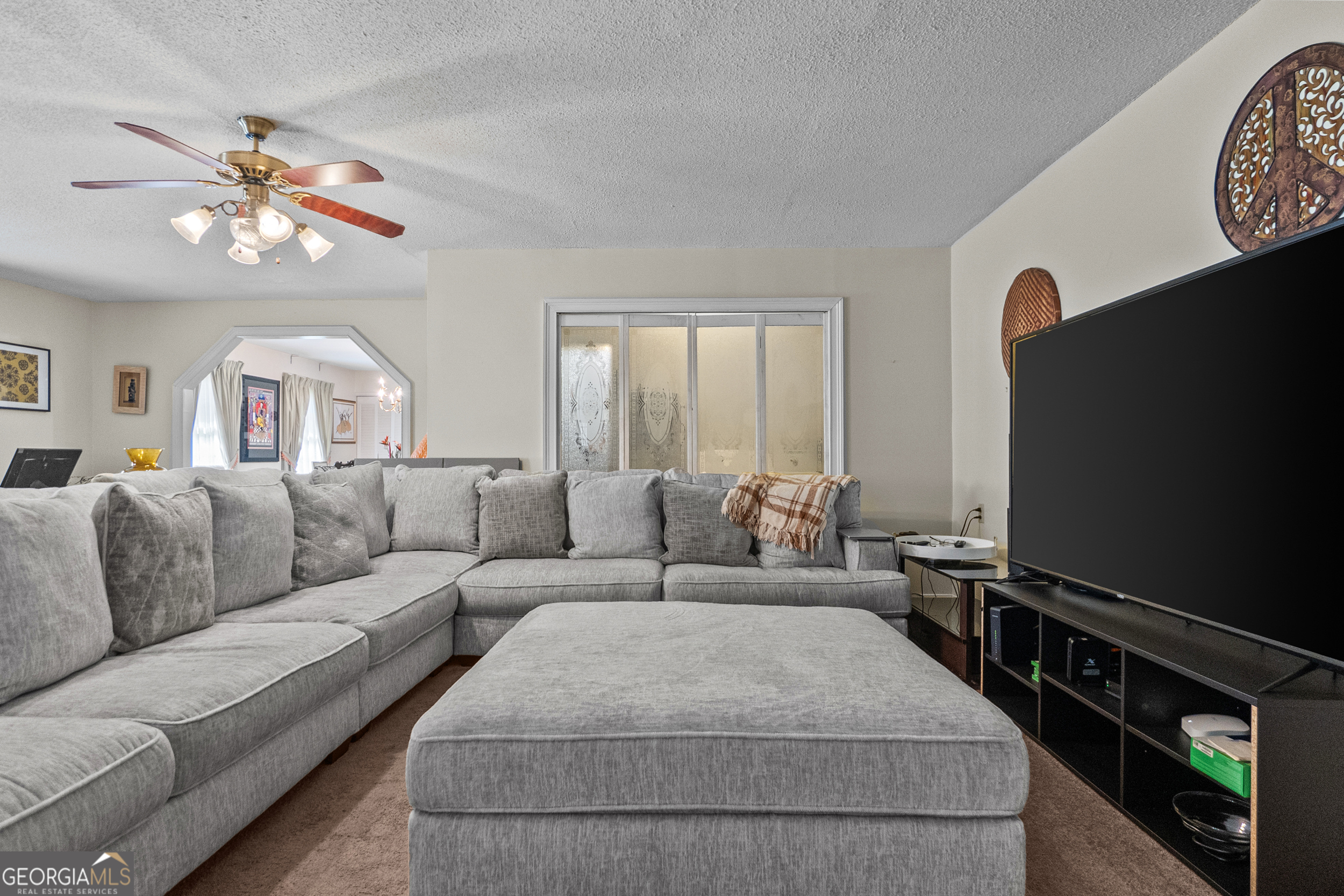 2101 Goldendale Lane Albany, GA 31721 - Photo 19 of 59 a living room with furniture a large window and a flat screen tv
