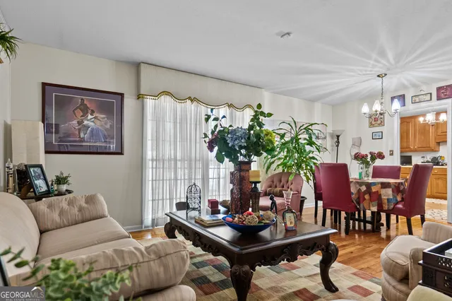 a kitchen with stainless steel appliances white cabinets and white appliances