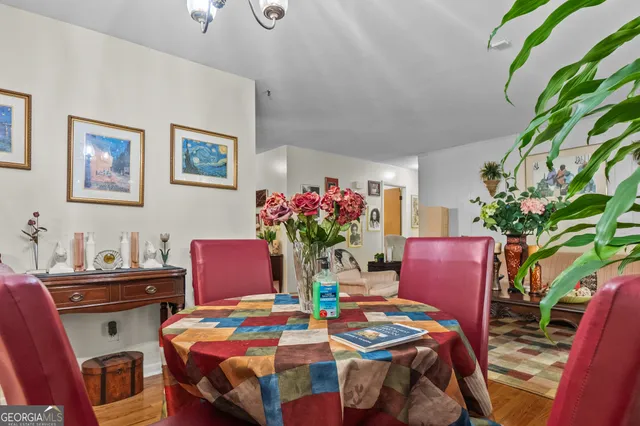 a kitchen with stainless steel appliances granite countertop a stove a sink dishwasher and cabinets with wooden floor