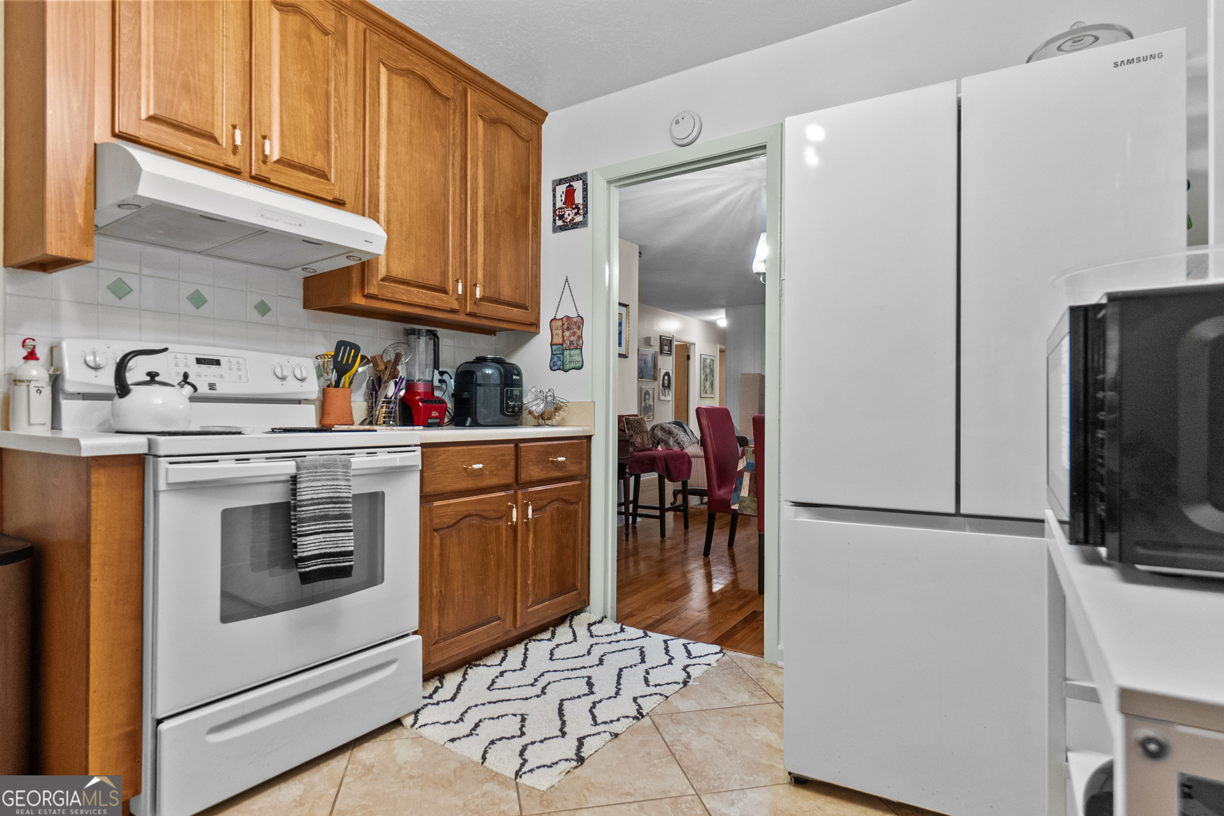 2101 Goldendale Lane Albany, GA 31721 - Photo 29 of 59 a kitchen with stainless steel appliances white cabinets and white appliances