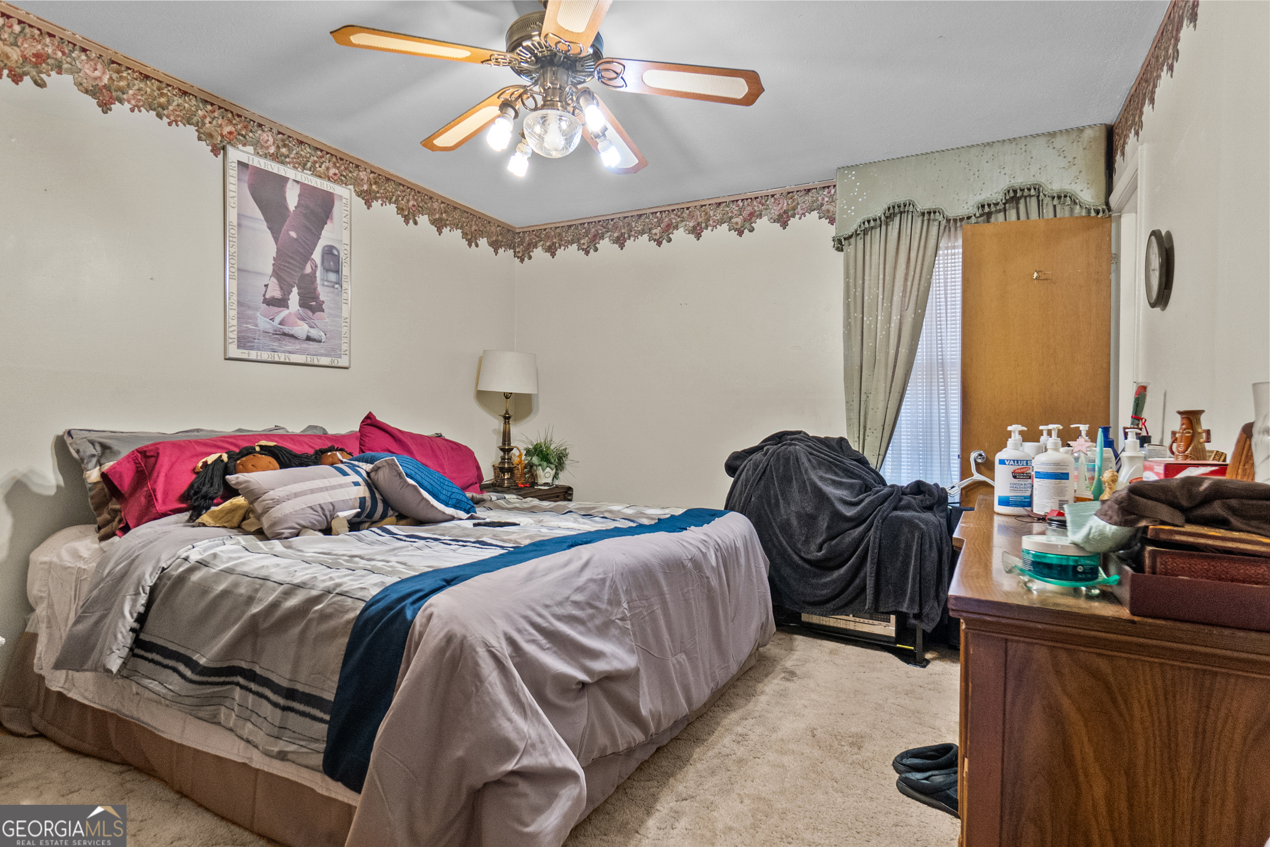 2101 Goldendale Lane Albany, GA 31721 - Photo 32 of 59 a bedroom with a bed and a chandelier