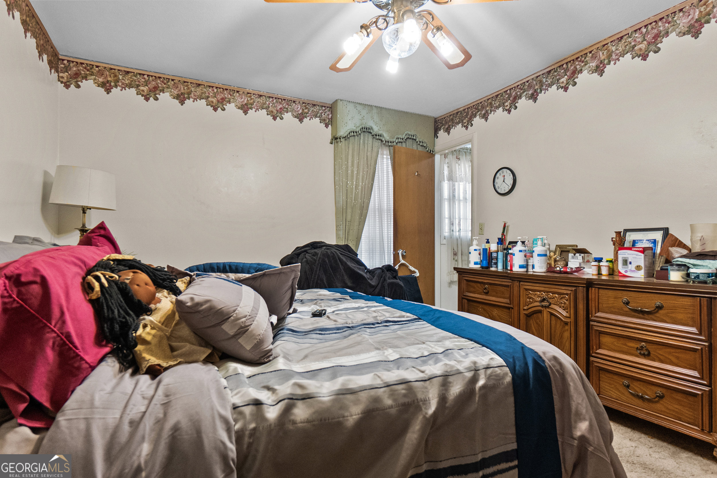 2101 Goldendale Lane Albany, GA 31721 - Photo 33 of 59 a bedroom with a bed and a chandelier