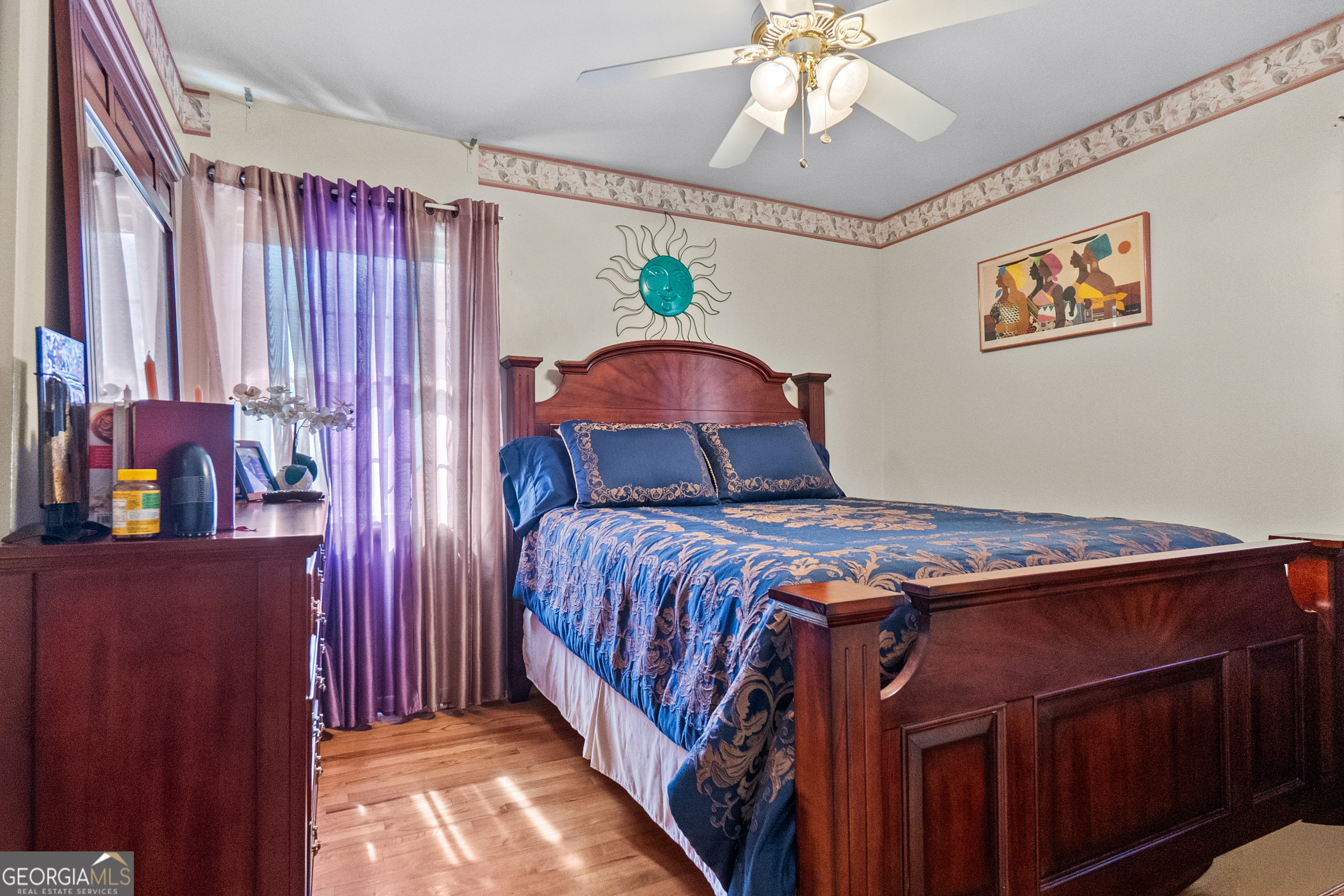 2101 Goldendale Lane Albany, GA 31721 - Photo 37 of 59 a bedroom with a bed and a chandelier