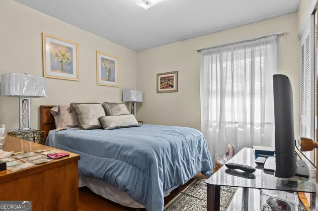 a living room with furniture and floor to ceiling windows