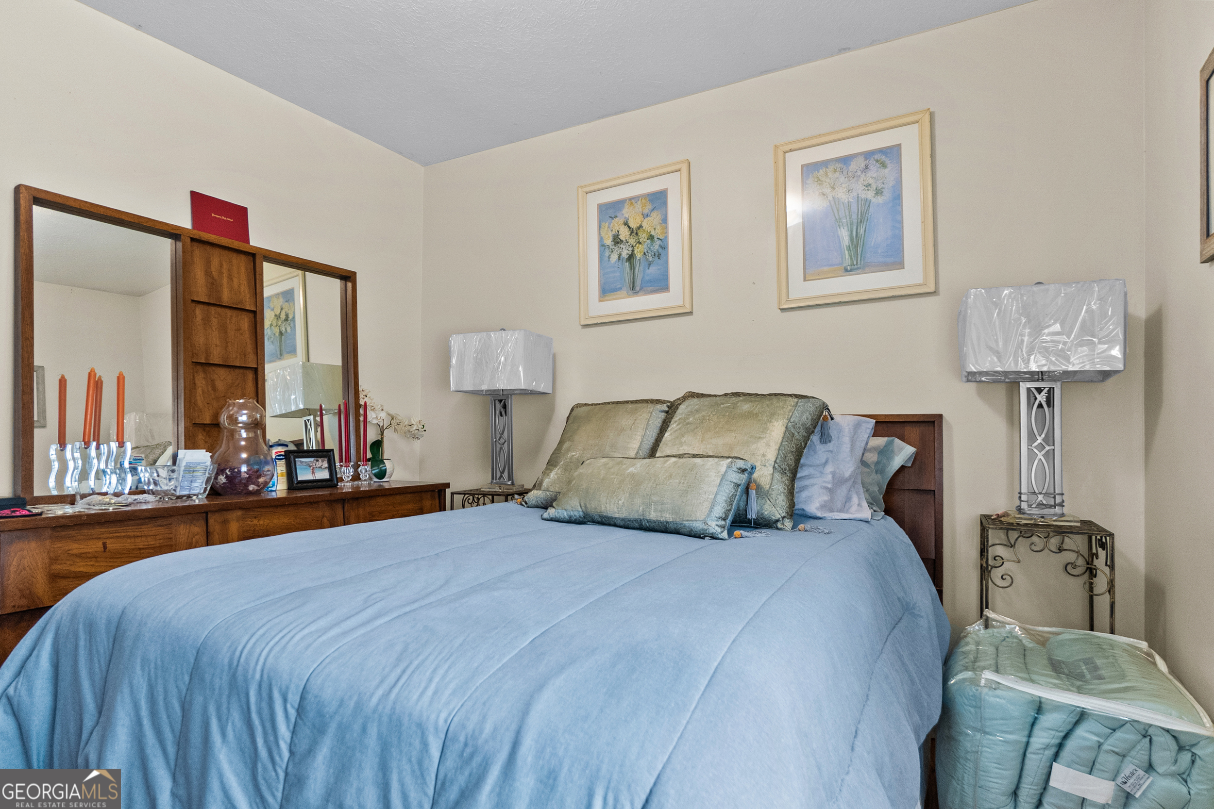 2101 Goldendale Lane Albany, GA 31721 - Photo 43 of 59 a bedroom with a large bed and a chandelier