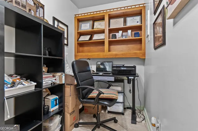 a view of a patio with chairs and a table