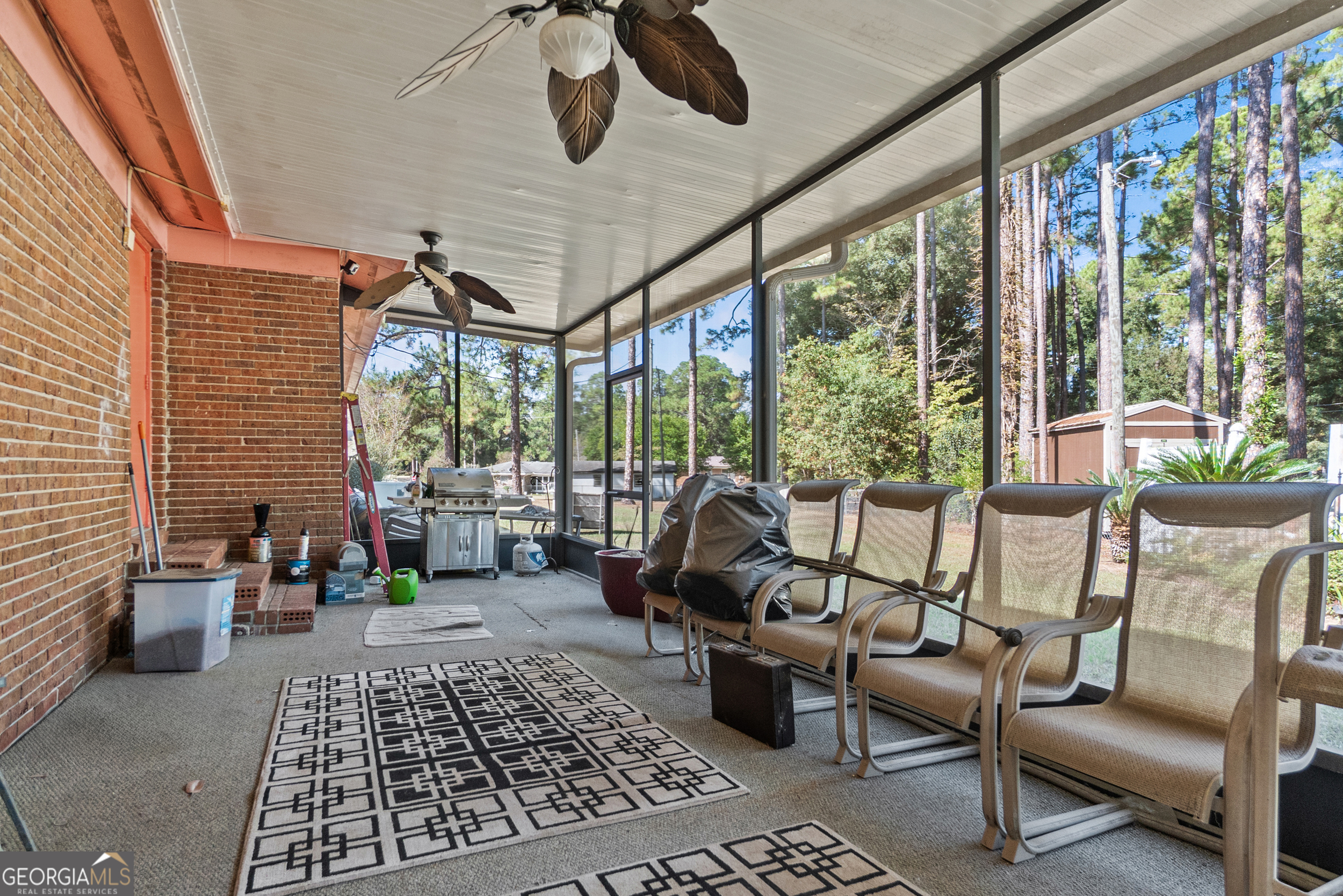 2101 Goldendale Lane Albany, GA 31721 - Photo 49 of 59 a living room with furniture and floor to ceiling windows