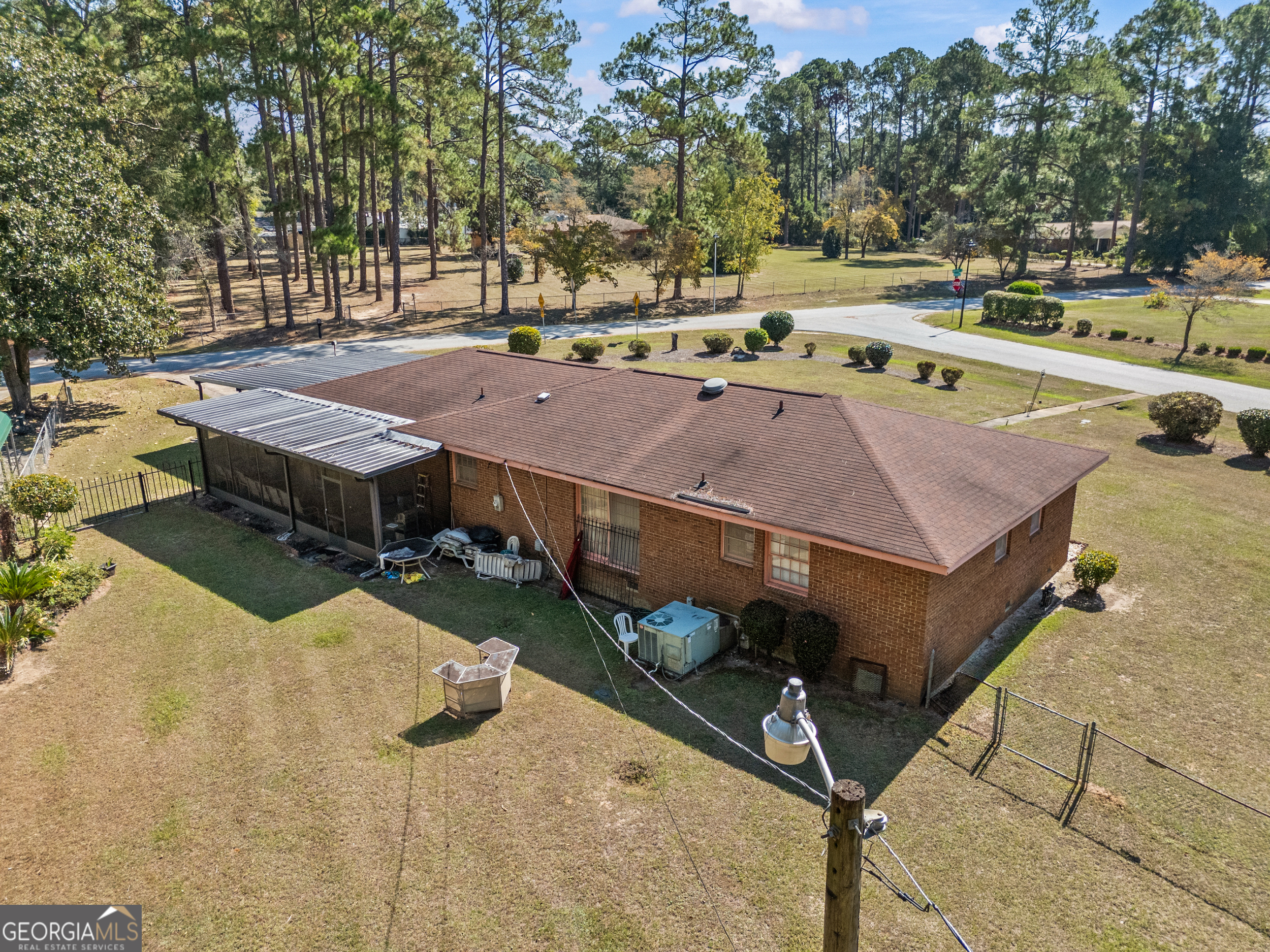 2101 Goldendale Lane Albany, GA 31721 - Photo 50 of 59 a view of a patio with a table and chairs