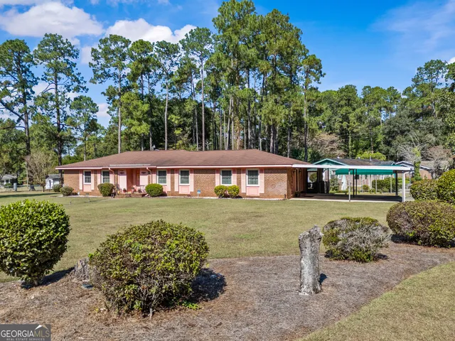 a aerial view of a house with a yard