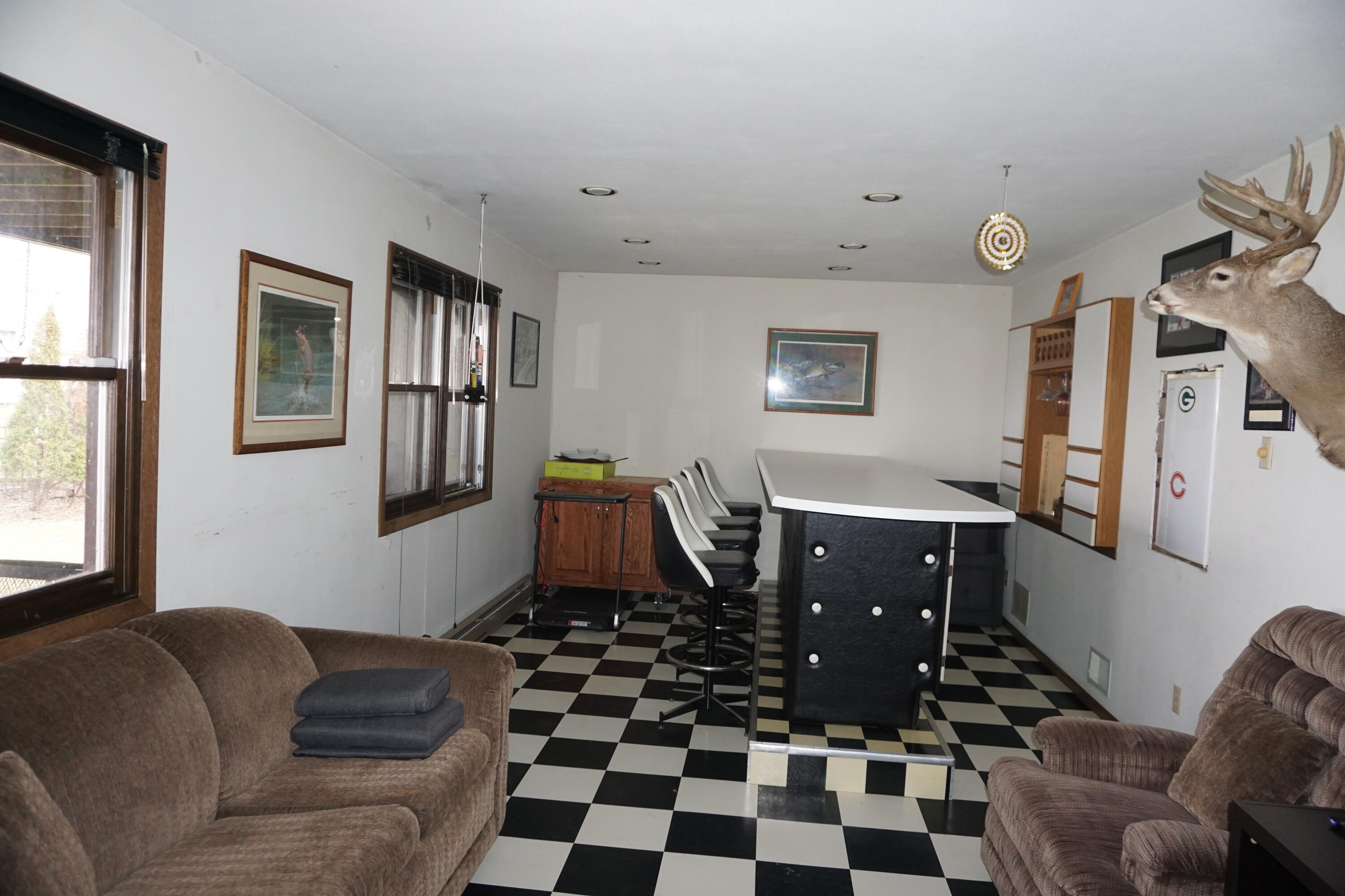 W183S7682 Kingston Drive Muskego, WI 53150 - Photo 14 of 20 Rec room with dry bar