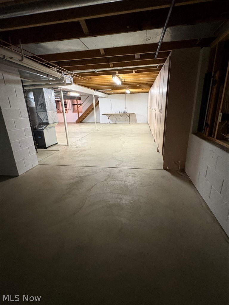 6475 Taylor Road Painesville, OH 44077 - Photo 14 of 23 Expansive unfinished basement featuring a concrete floor