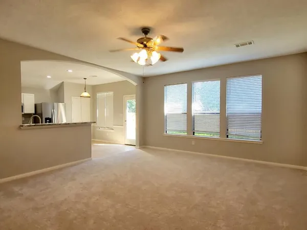 a view of an empty room with a window
