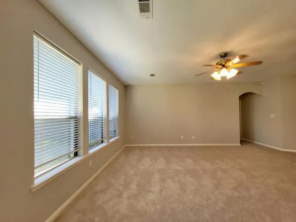 a view of an empty room with a window