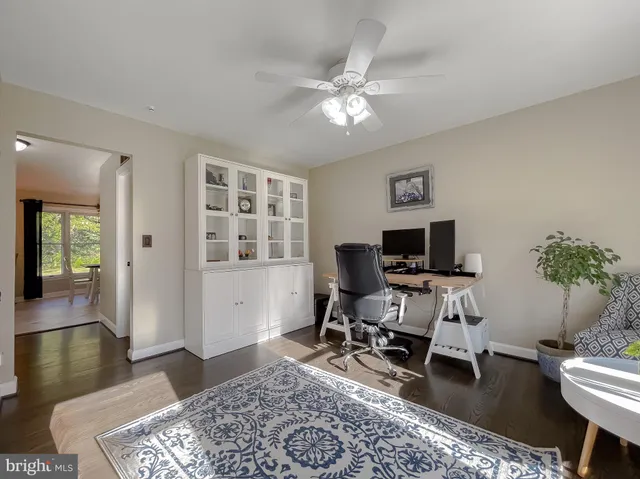 a spacious bedroom with a bed and a chandelier