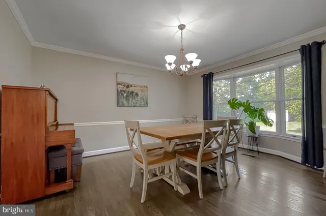 a kitchen with stainless steel appliances granite countertop a sink and dishwasher a stove top oven with white cabinets