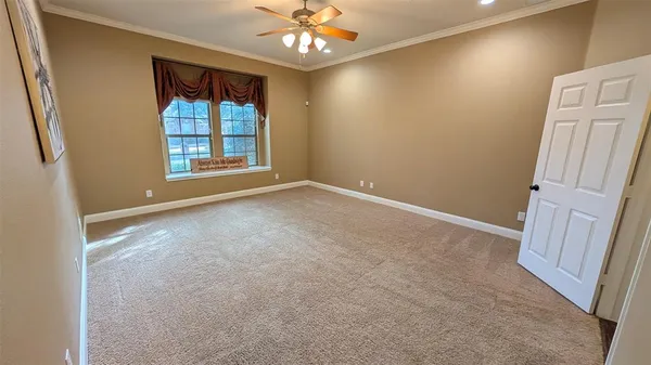 an empty room with windows and entrance