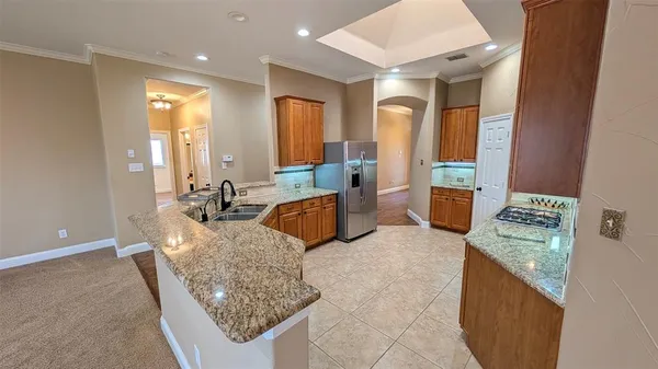 a living room with granite countertop furniture and a couch