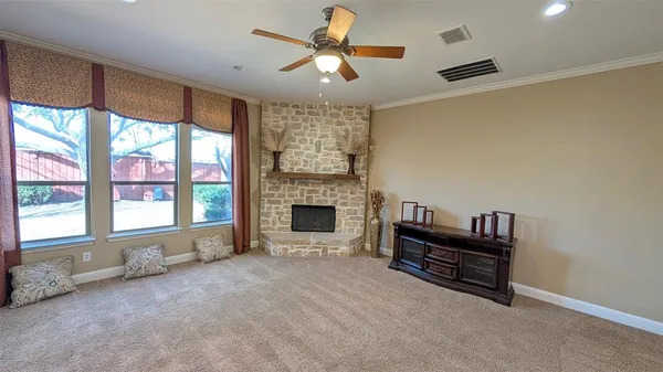 a view of livingroom with furniture fireplace and window